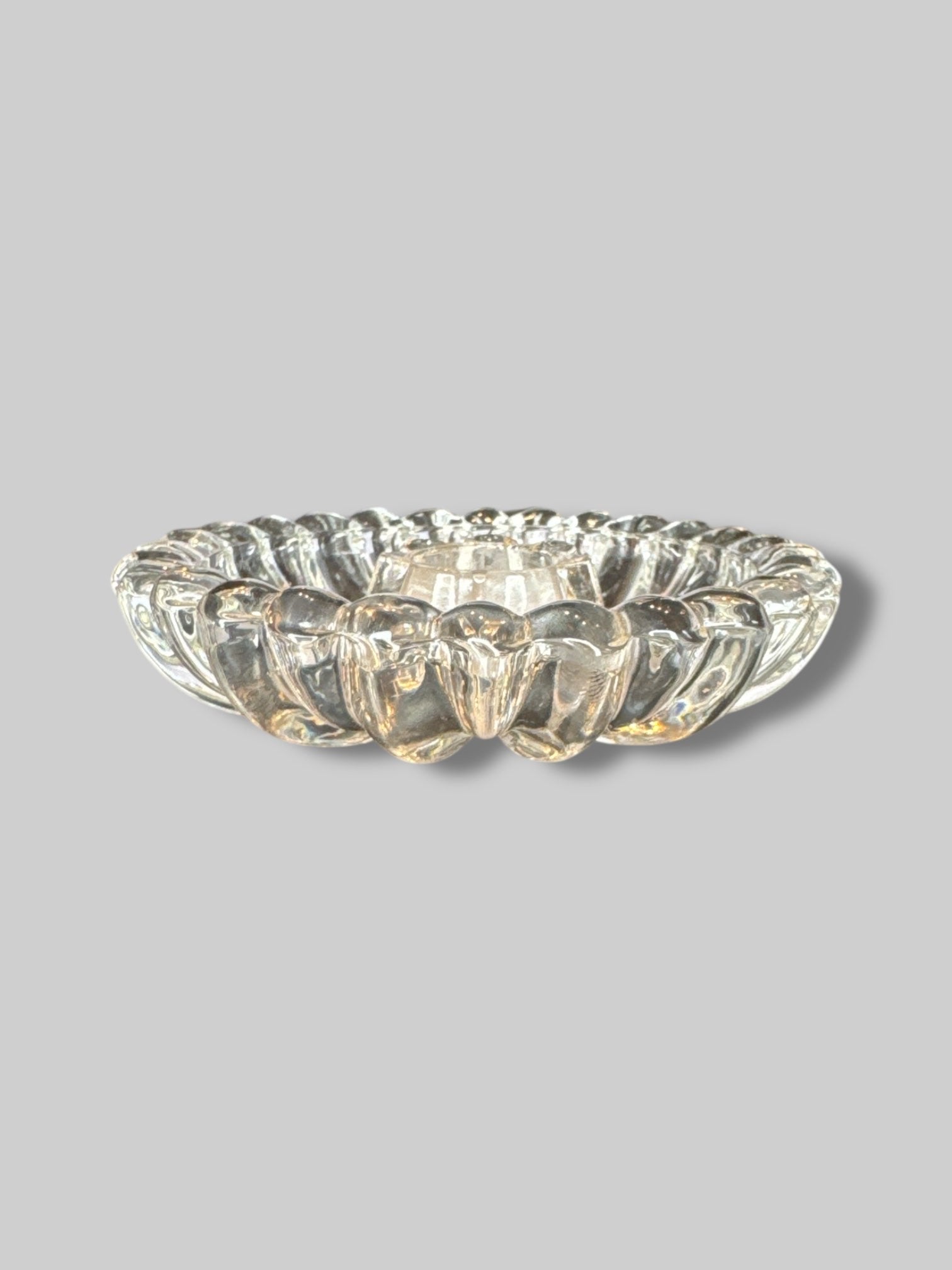 Glass flower shaped candle holder