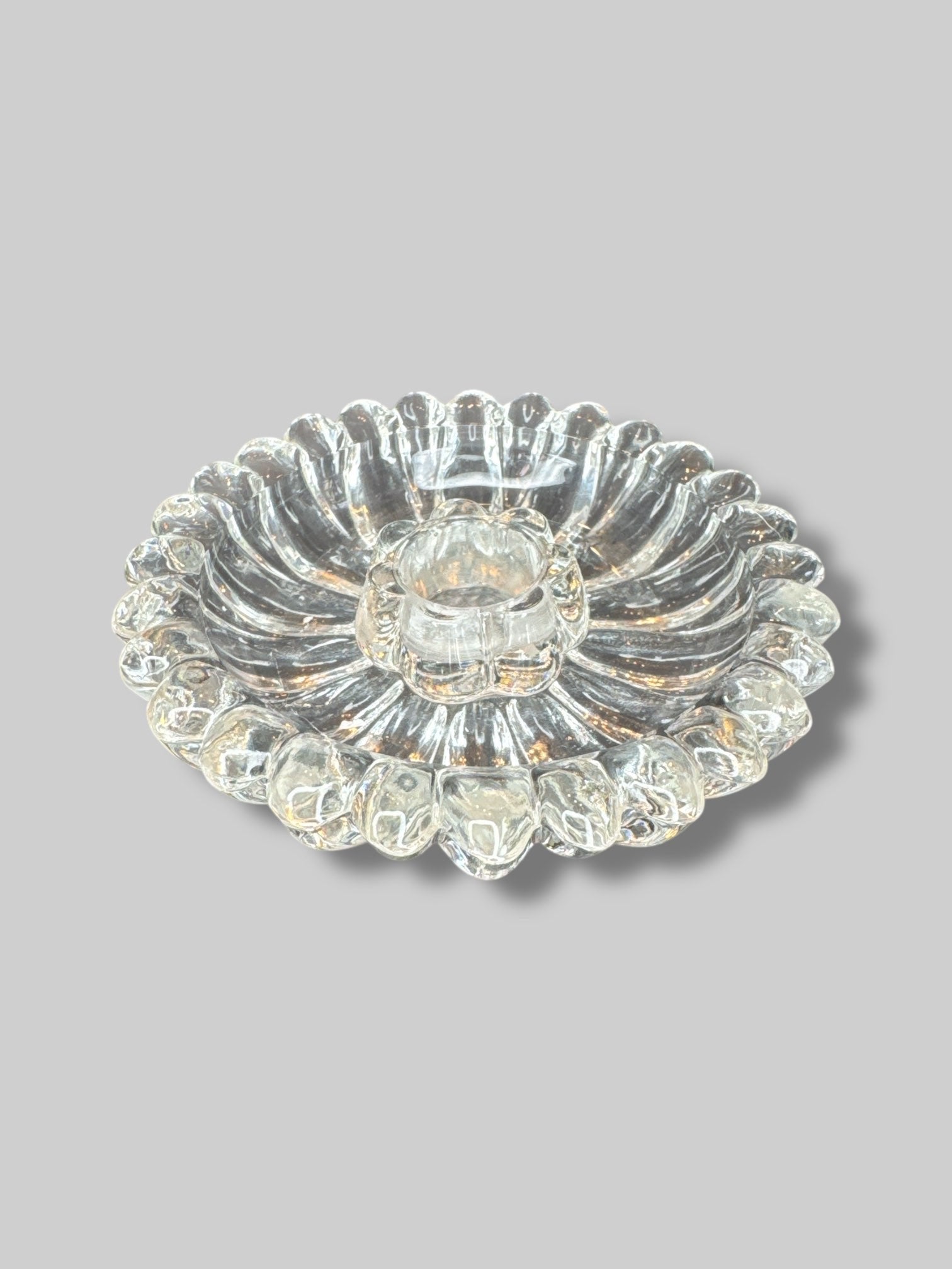 Glass flower shaped candle holder