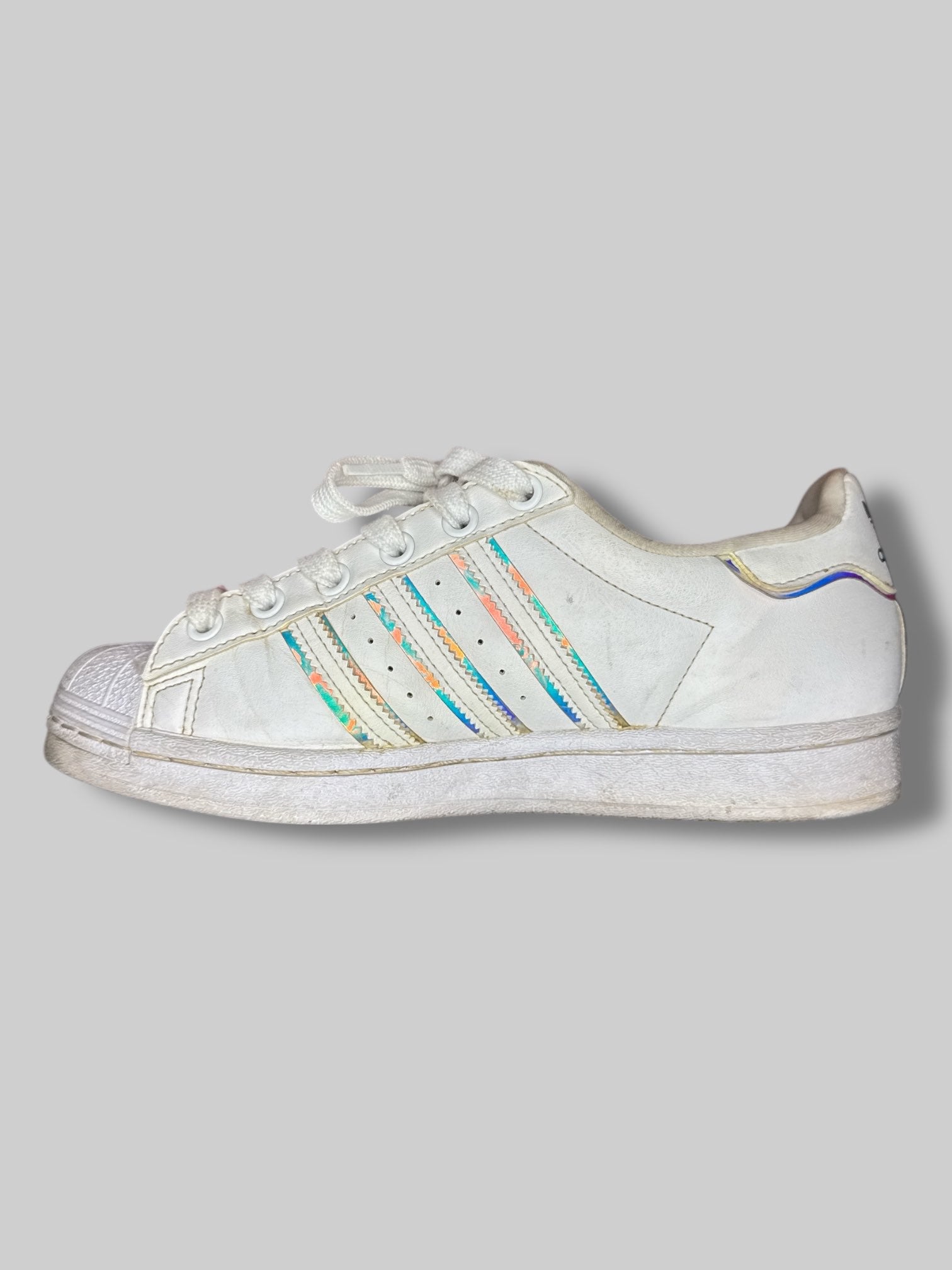 Size 5 1/2 White Adidas sneakers with holographic details, and festival beading on laces