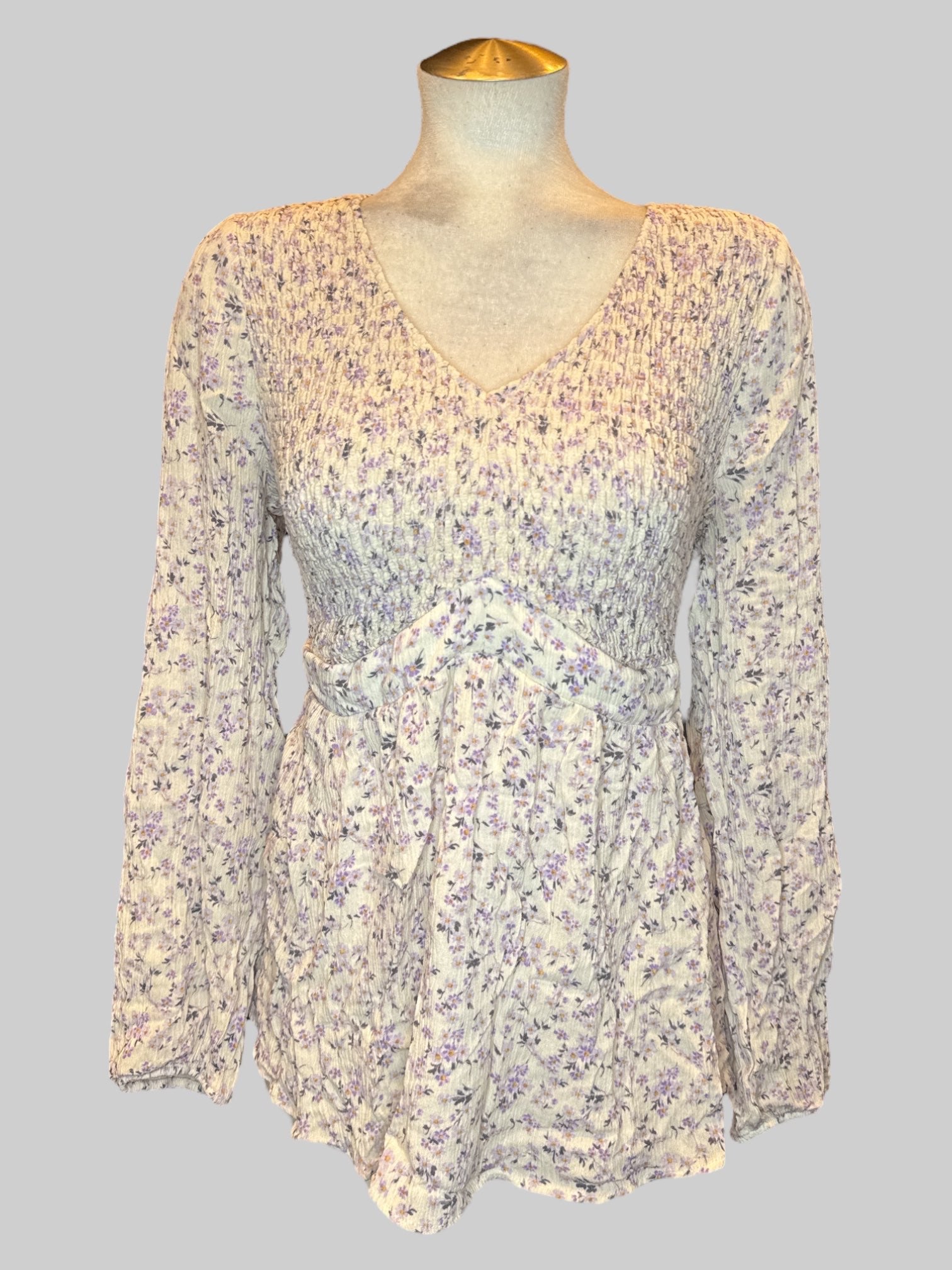 1X white long sleeve shirt with purple florals, and shirred bodice