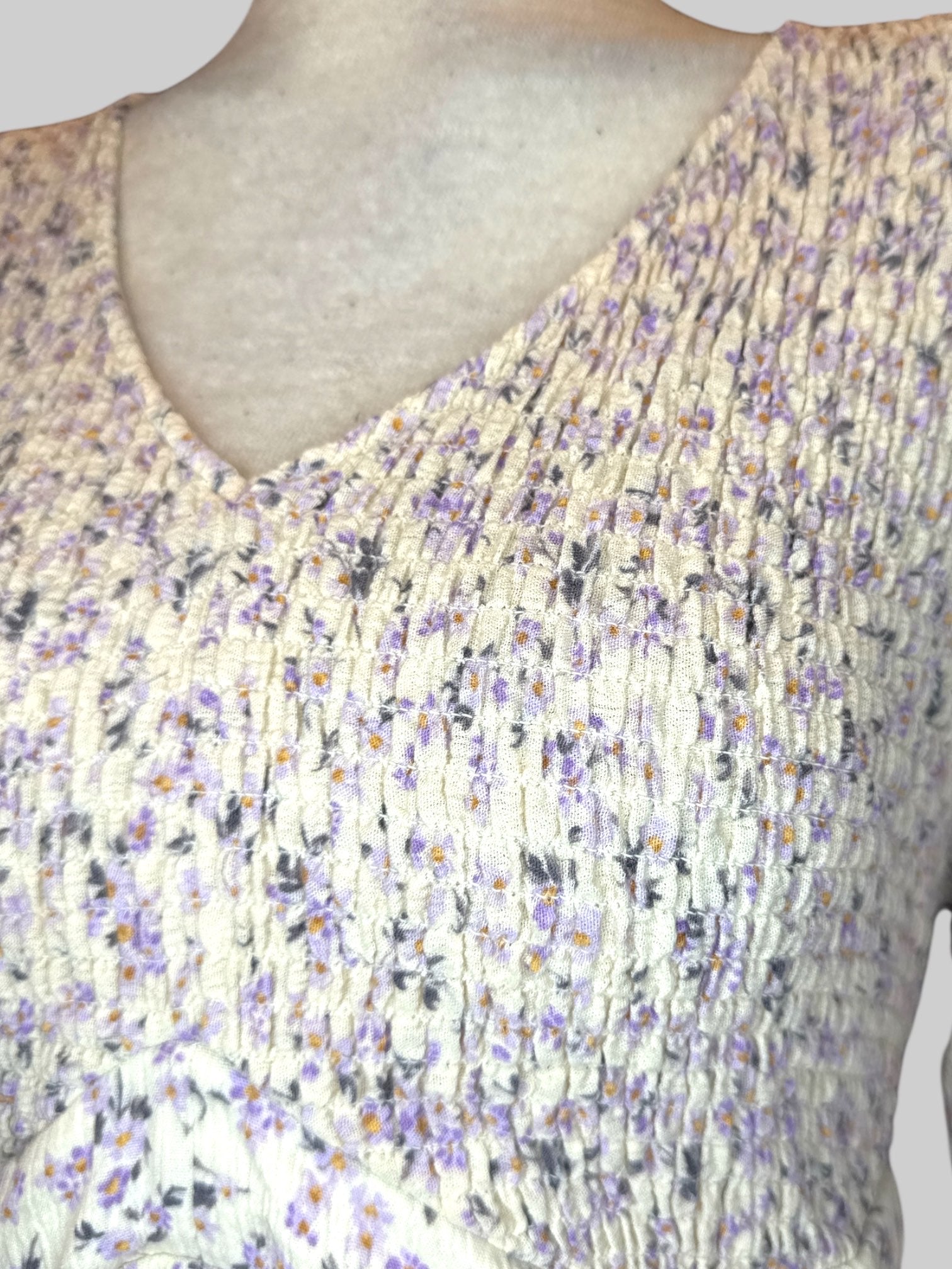 1X white long sleeve shirt with purple florals, and shirred bodice