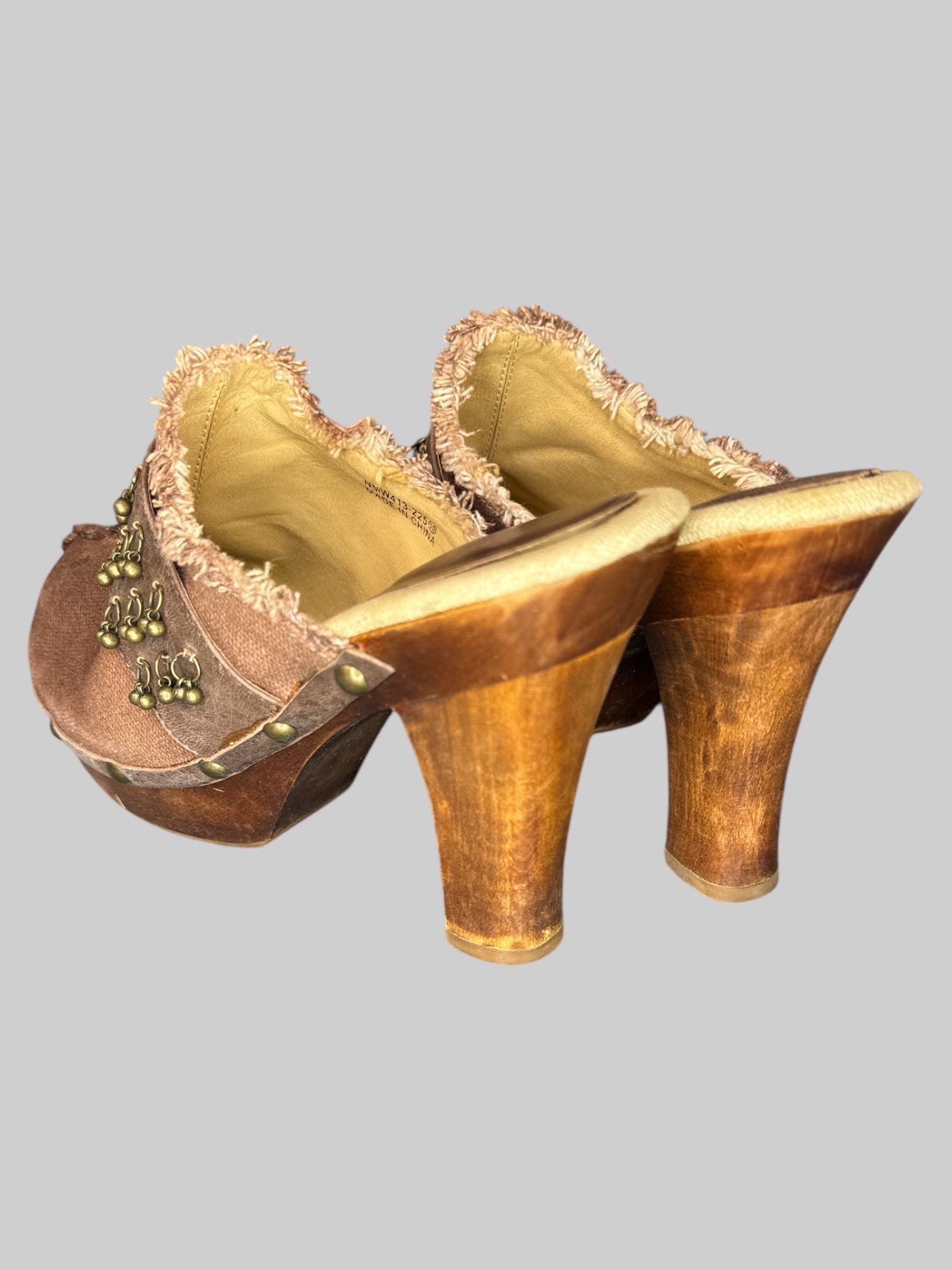 Size 10 brown Naughty Monkey boot heels with charms and front