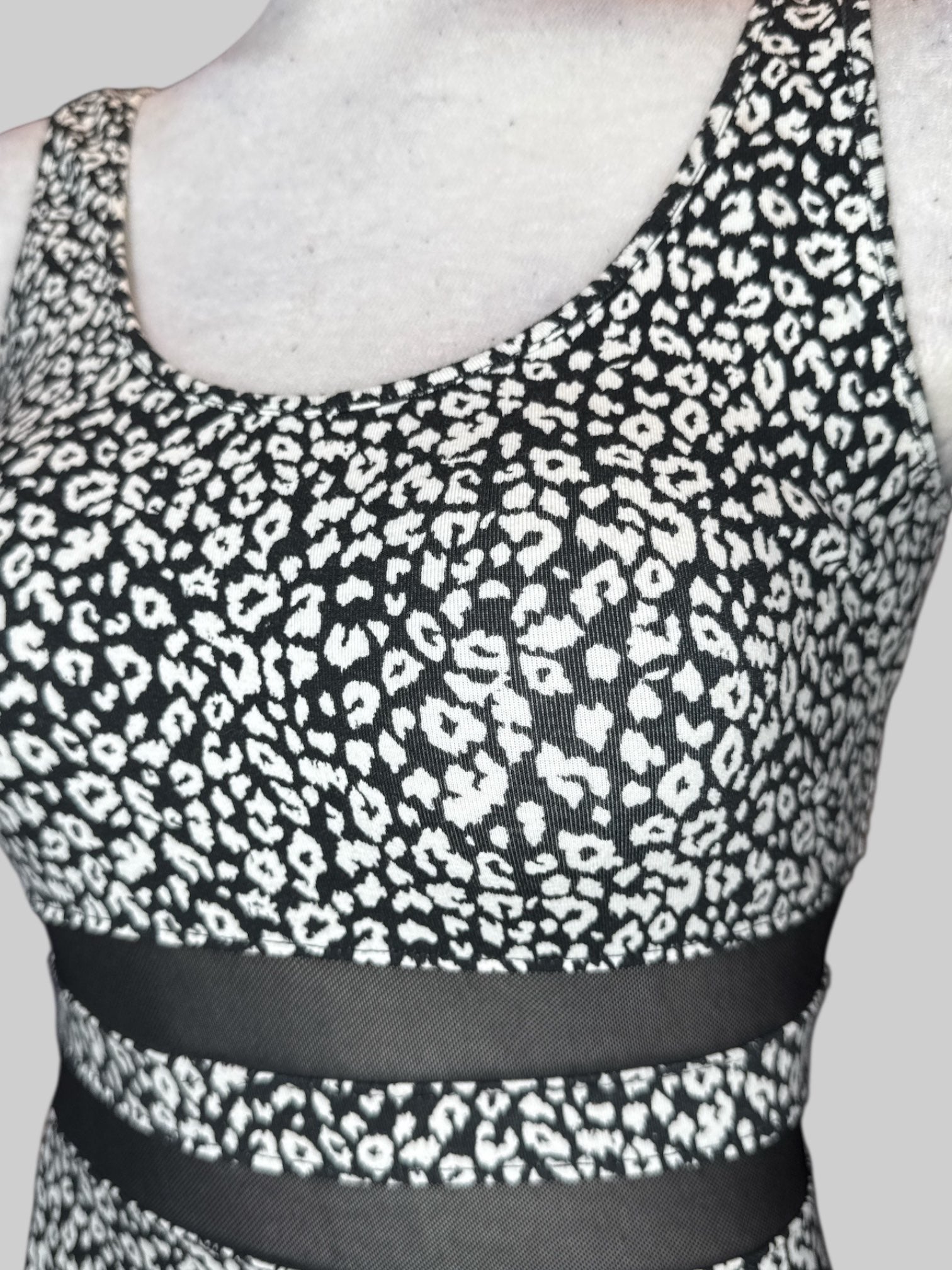 M black and white animal print body con dress with mesh waist area cutouts