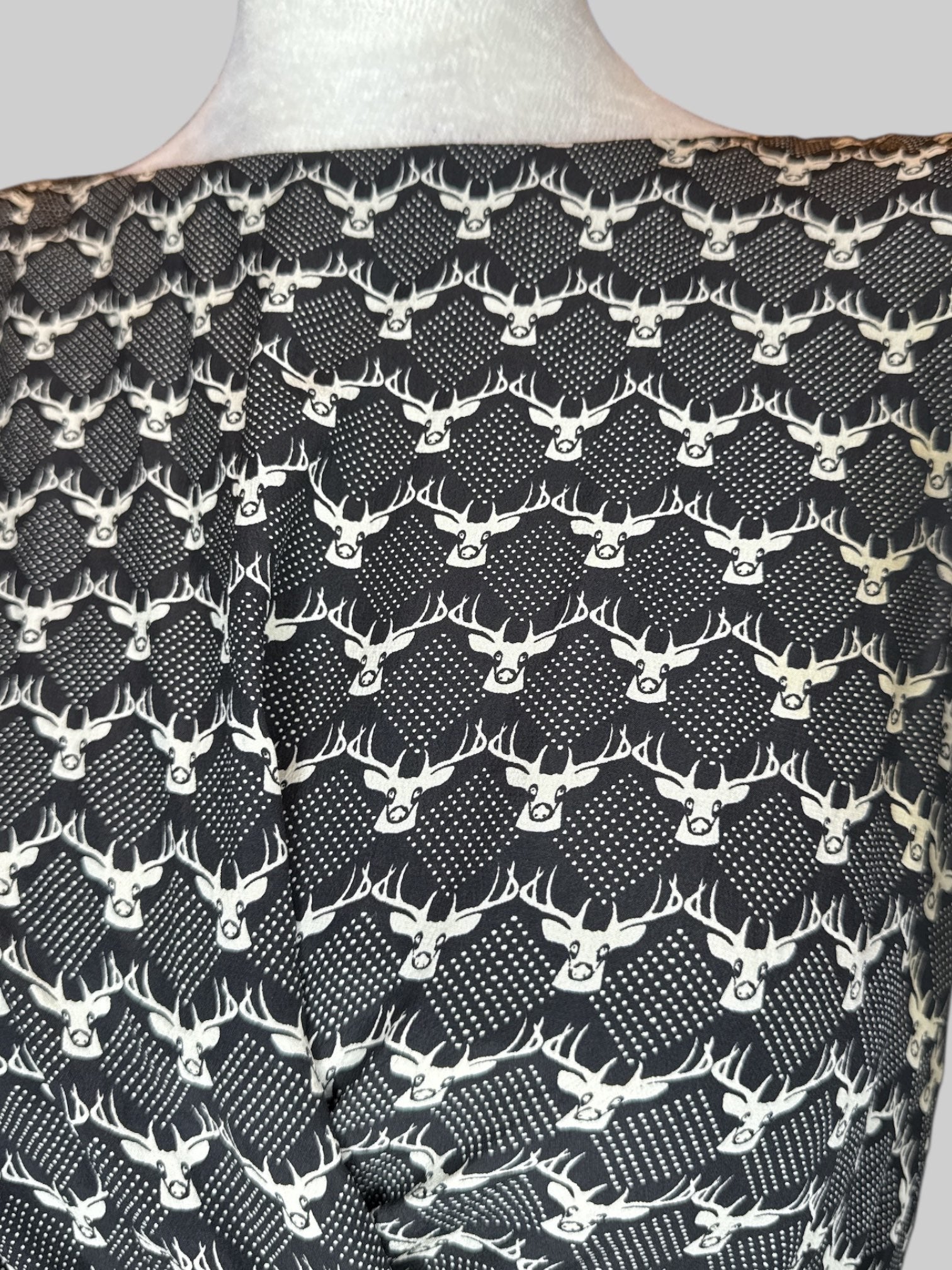 M black dress with white deer pattern and tie