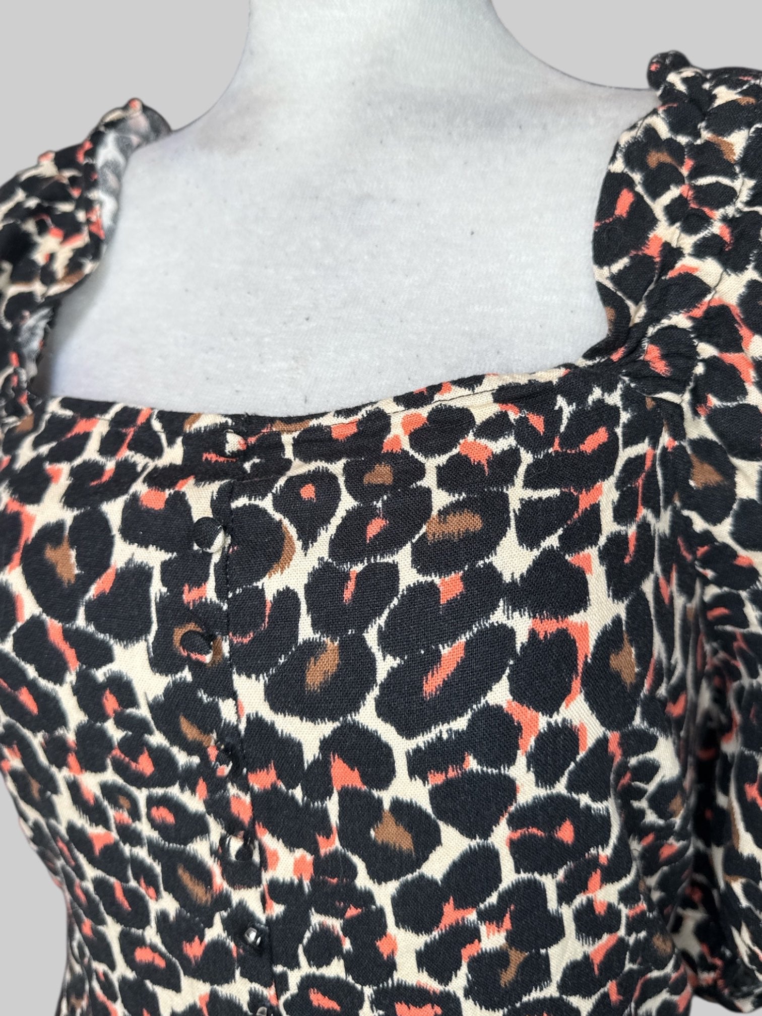 2X tan dress with black brown and pink animal, print dress with balloon sleeves and shirred back