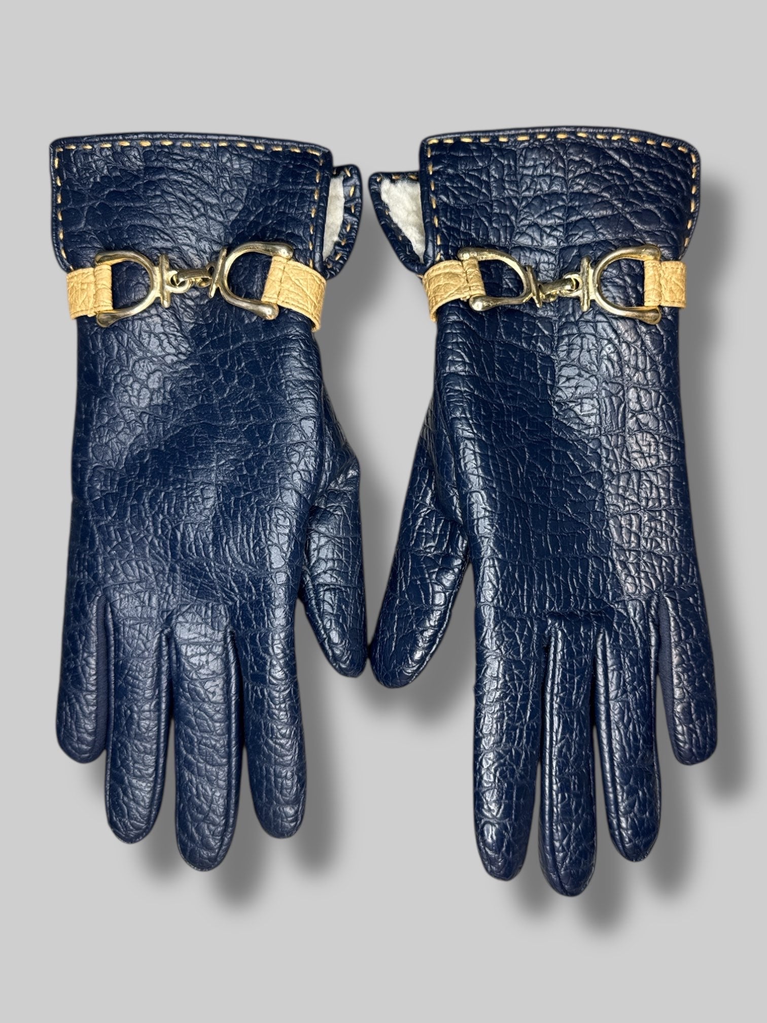 navy blue gloves with gold color chain