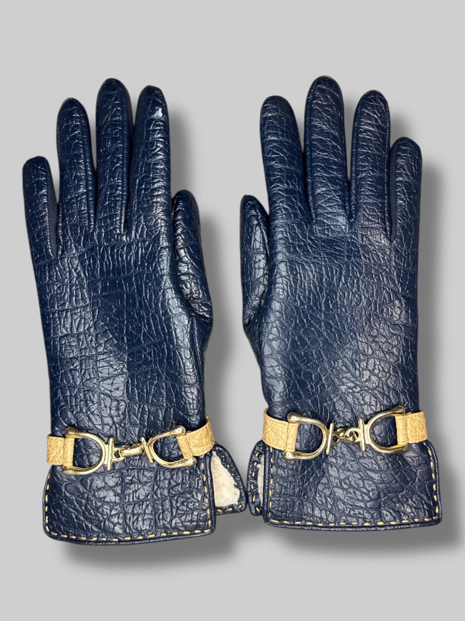 navy blue gloves with gold color chain
