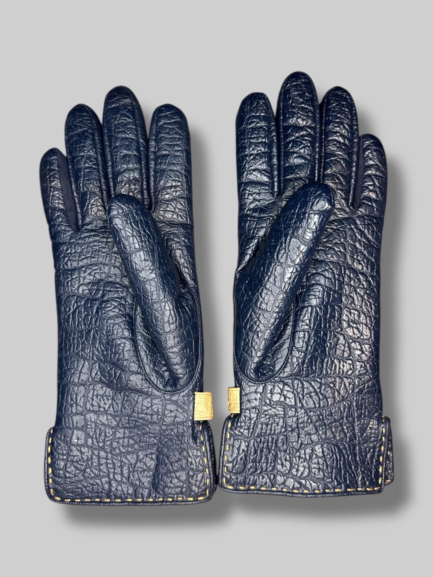 navy blue gloves with gold color chain