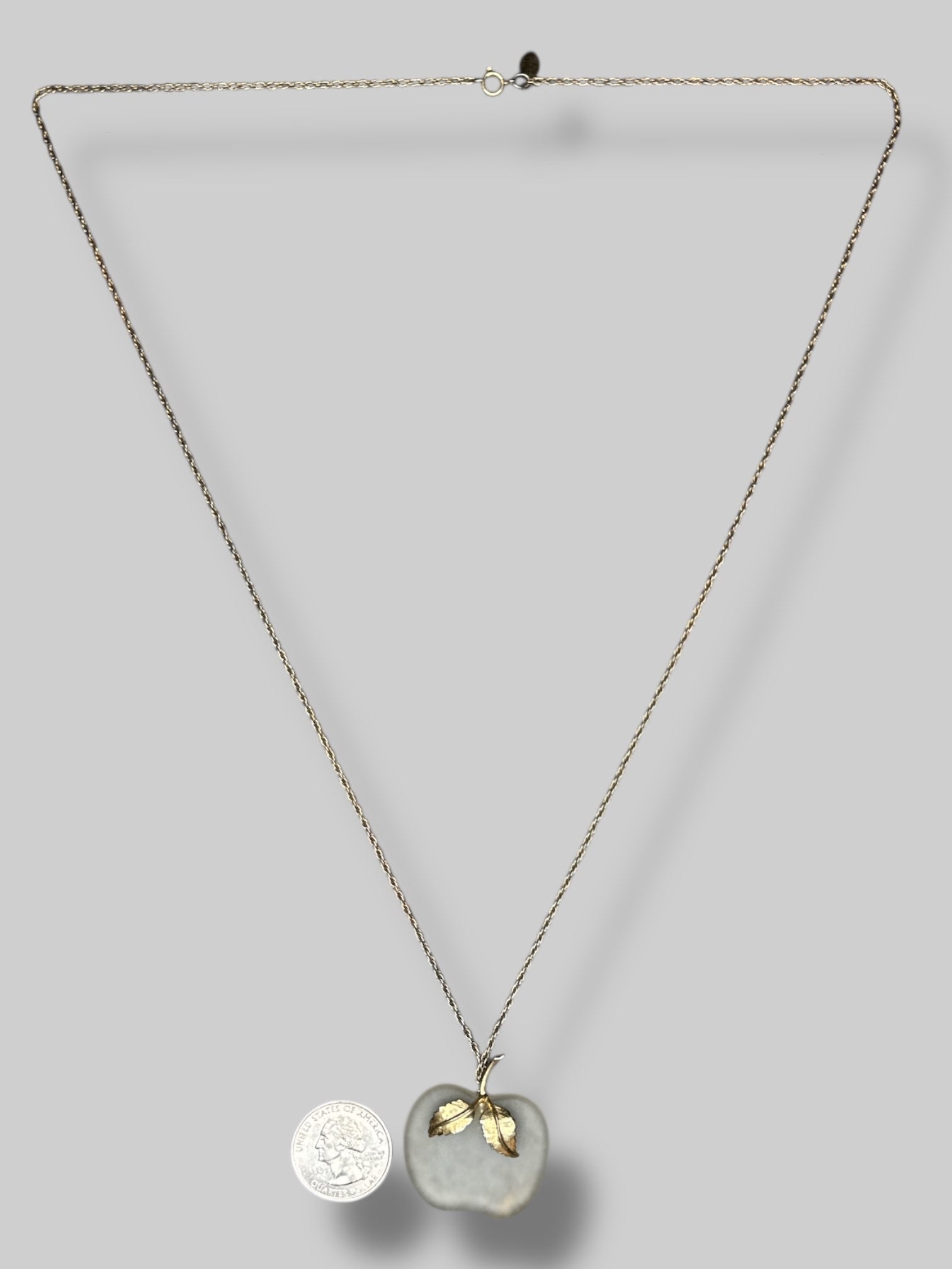 long gold color chain necklace with clear apple pendant