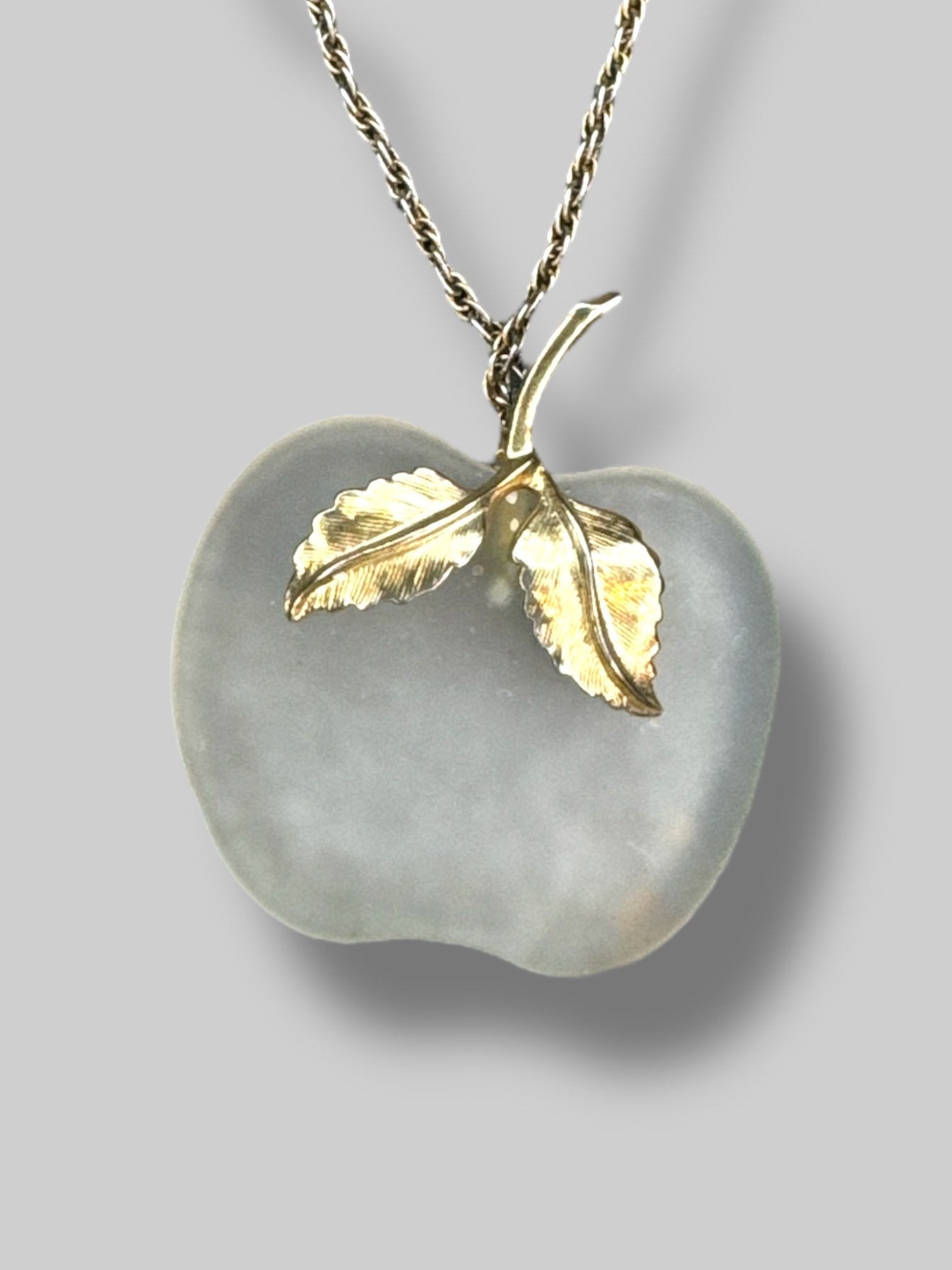 long gold color chain necklace with clear apple pendant