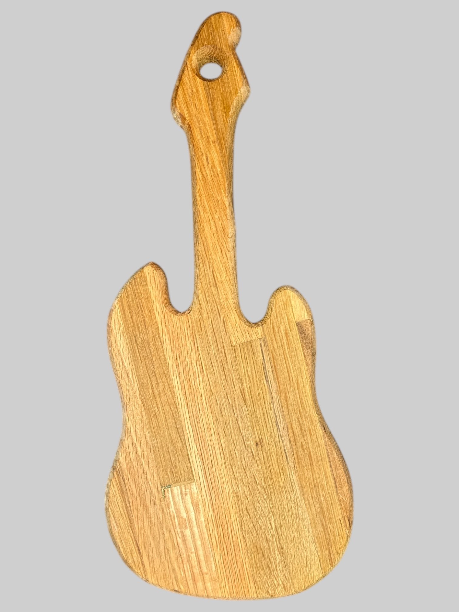 Wooden guitar shaped cutting board