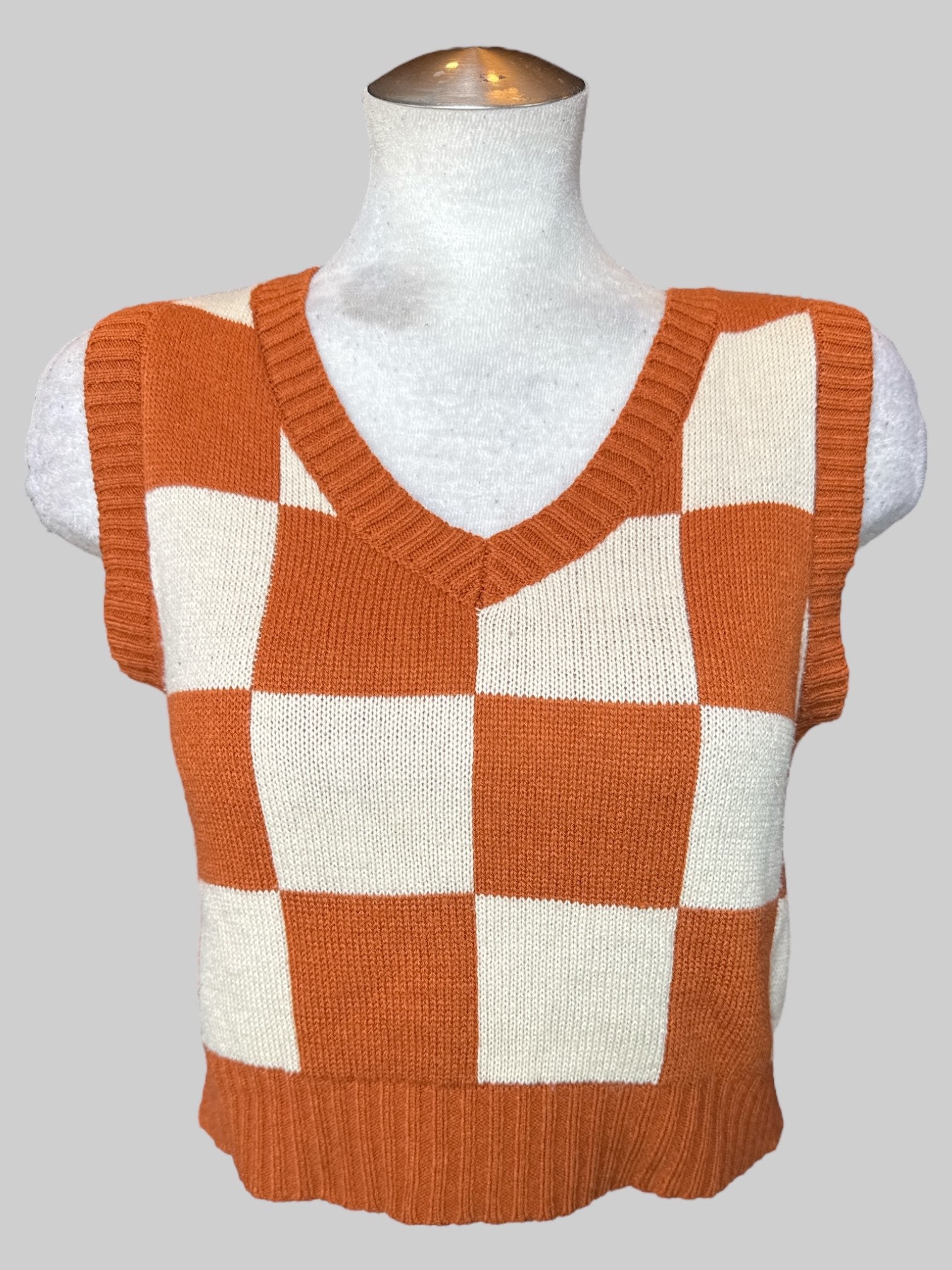 S Brownish orange and cream color checkered sweater vest