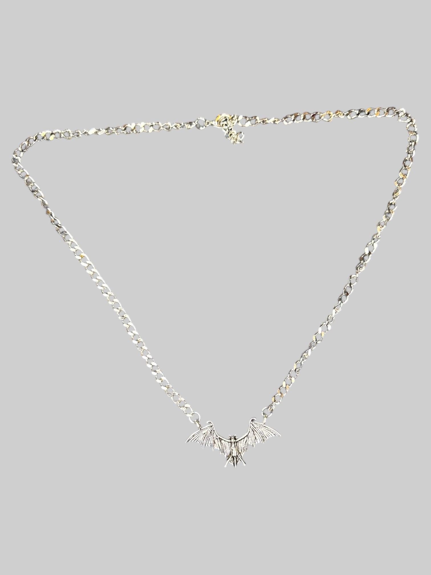 Silver tone bat necklace