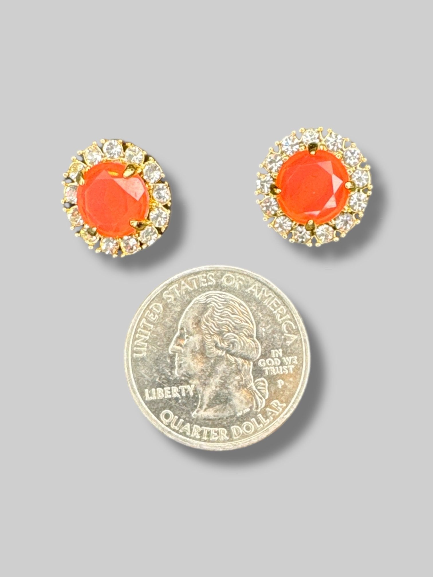 Silver and gold tone with pinkish orange middle stud earrings