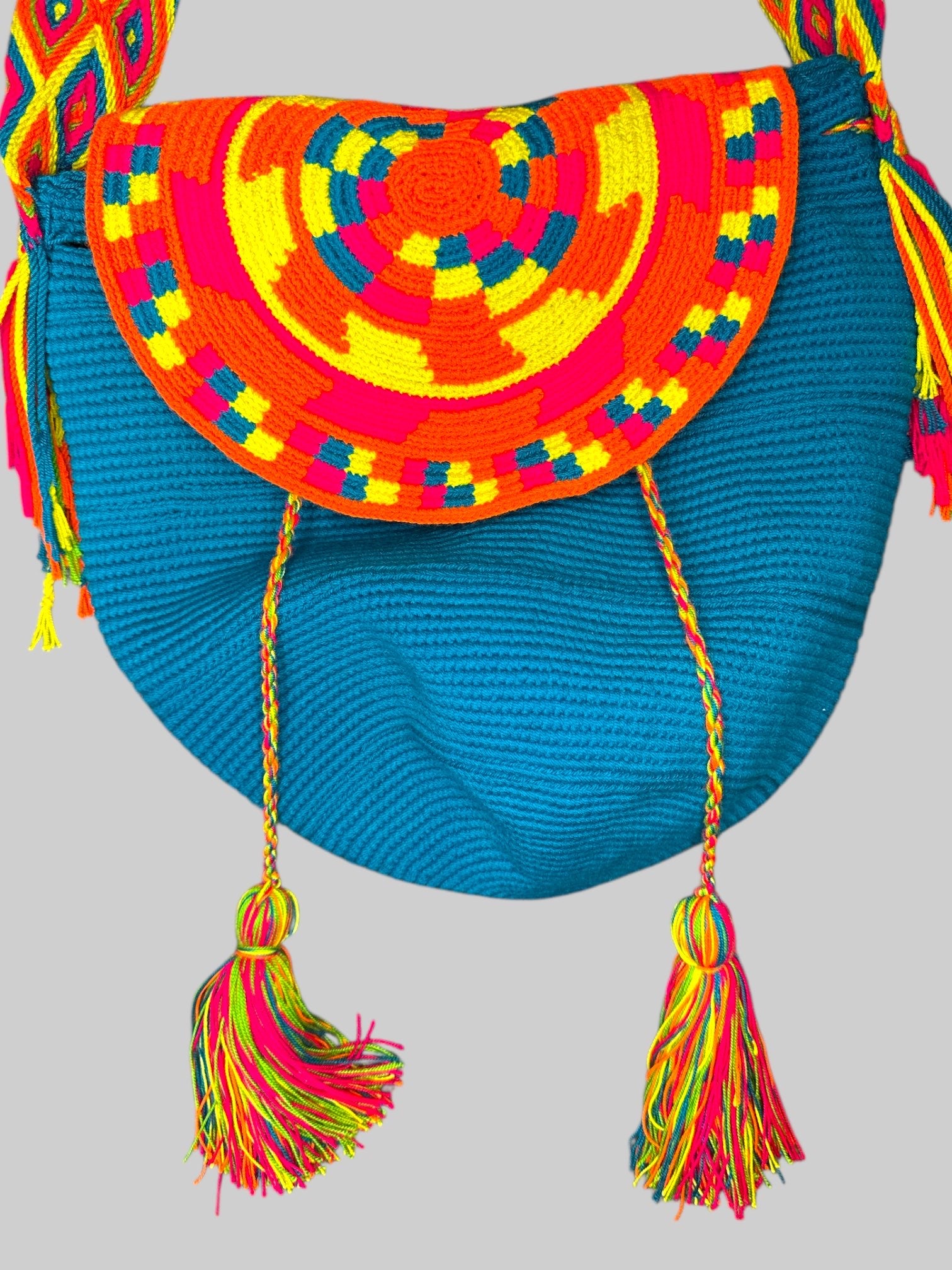 Blue knit bag with beautiful multicolor knit straps and tassels