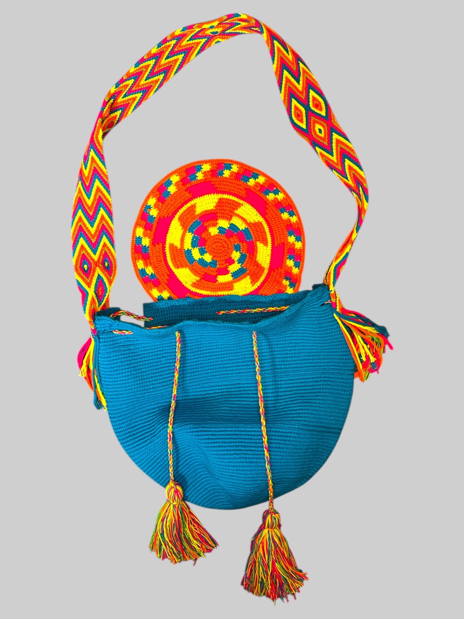 Blue knit bag with beautiful multicolor knit straps and tassels