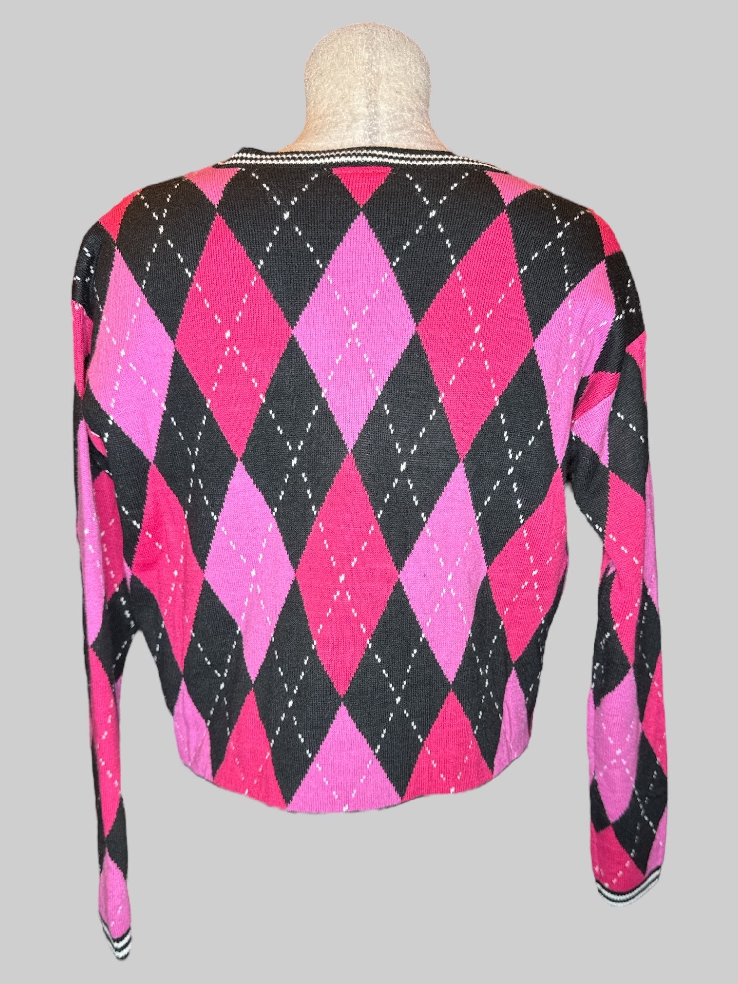 S Monster High pink, black, and white argyle pattern cropped sweater