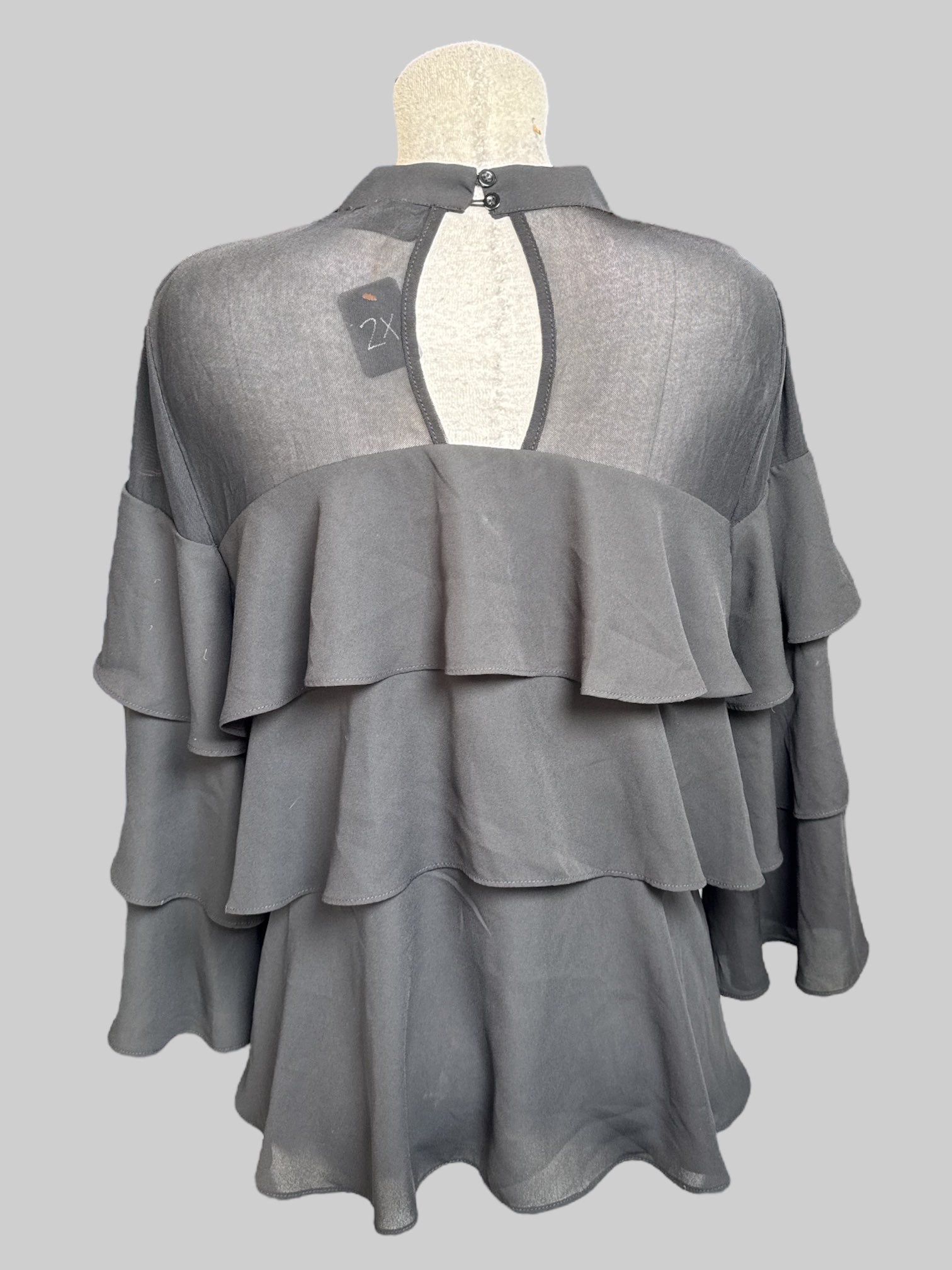 2X Black ruffle top with sheer upper chest and keyhole back