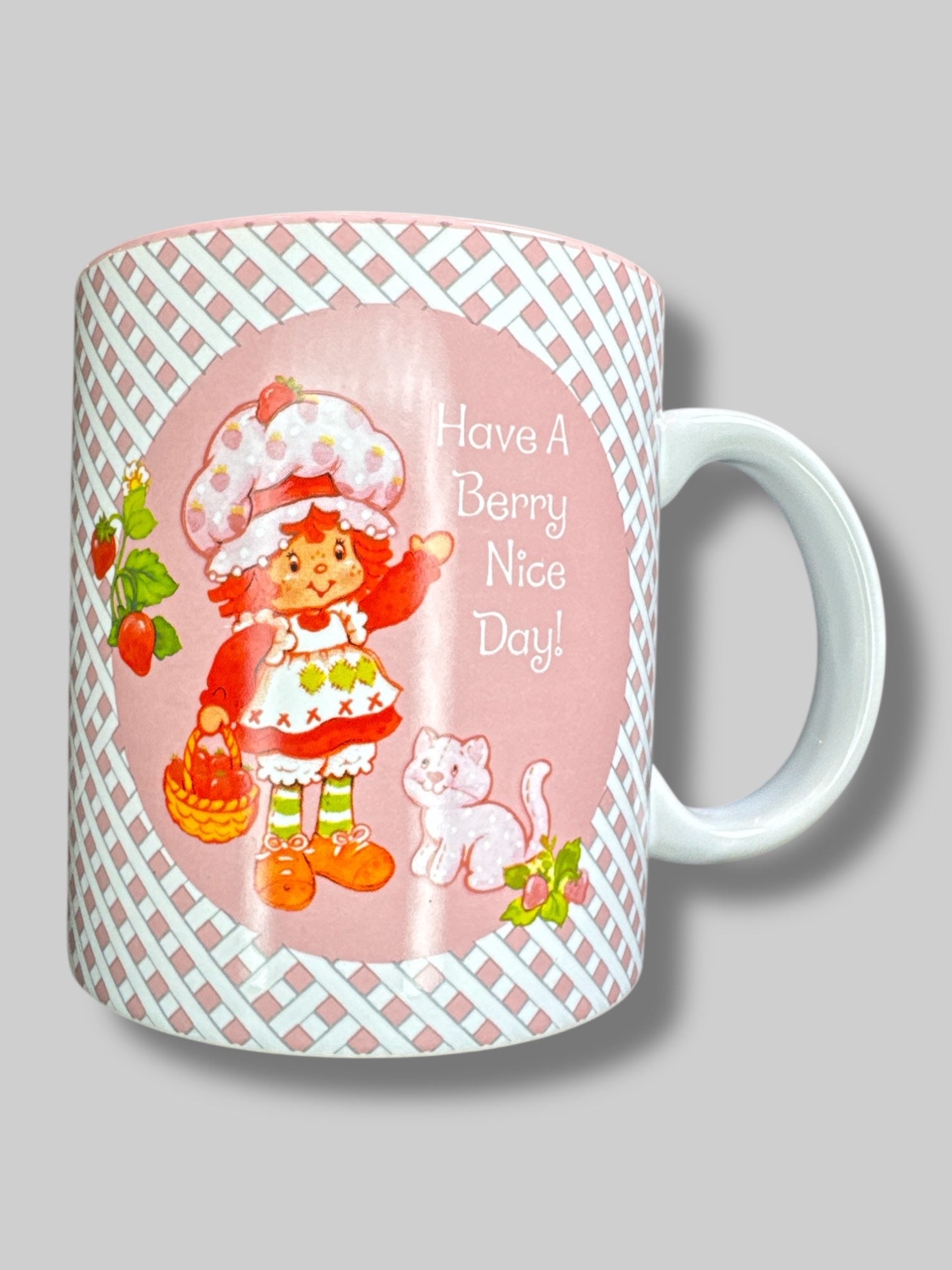 Pink and white “Have a berry nice day” strawberry shortcake mug
