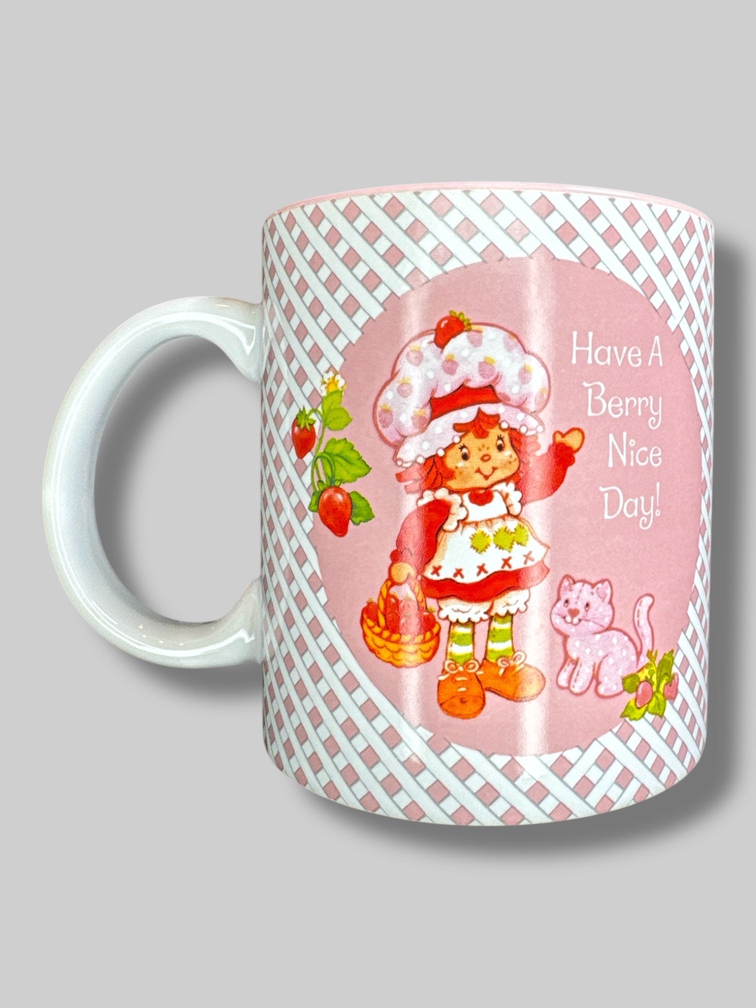 Pink and white “Have a berry nice day” strawberry shortcake mug