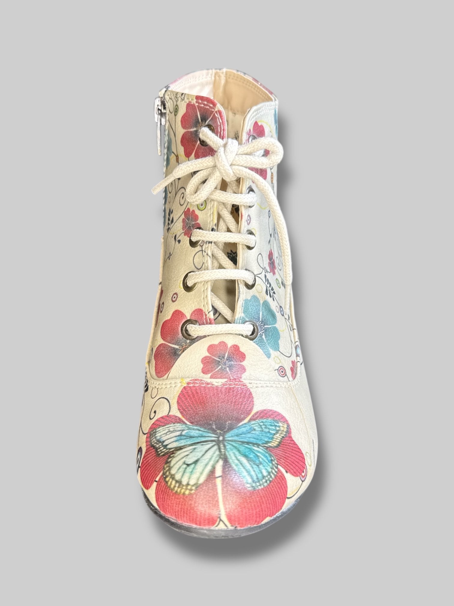 Beige boot heels with lacing, red and blue florals, and zippers on sides