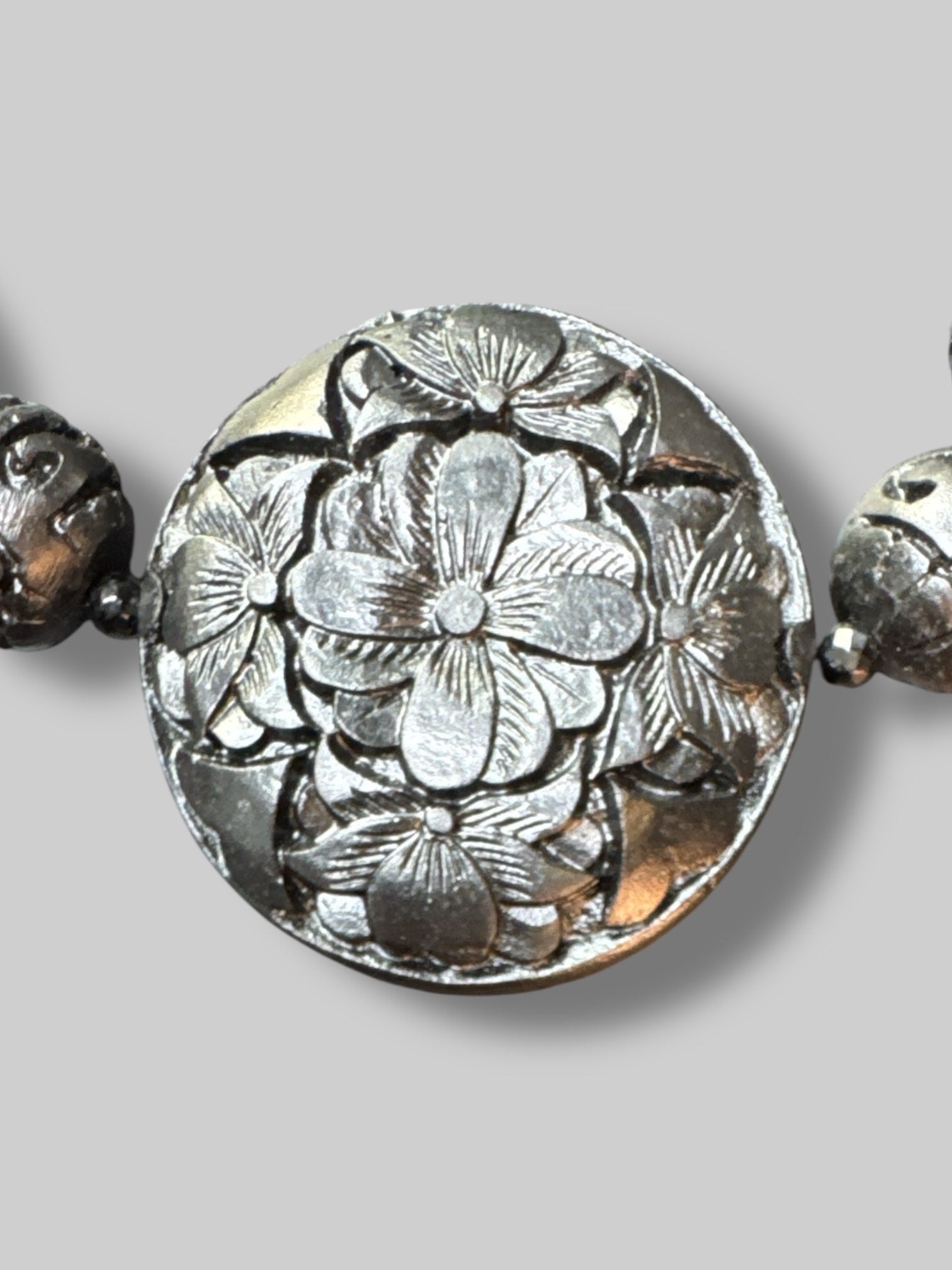 Black beads with carved florals
