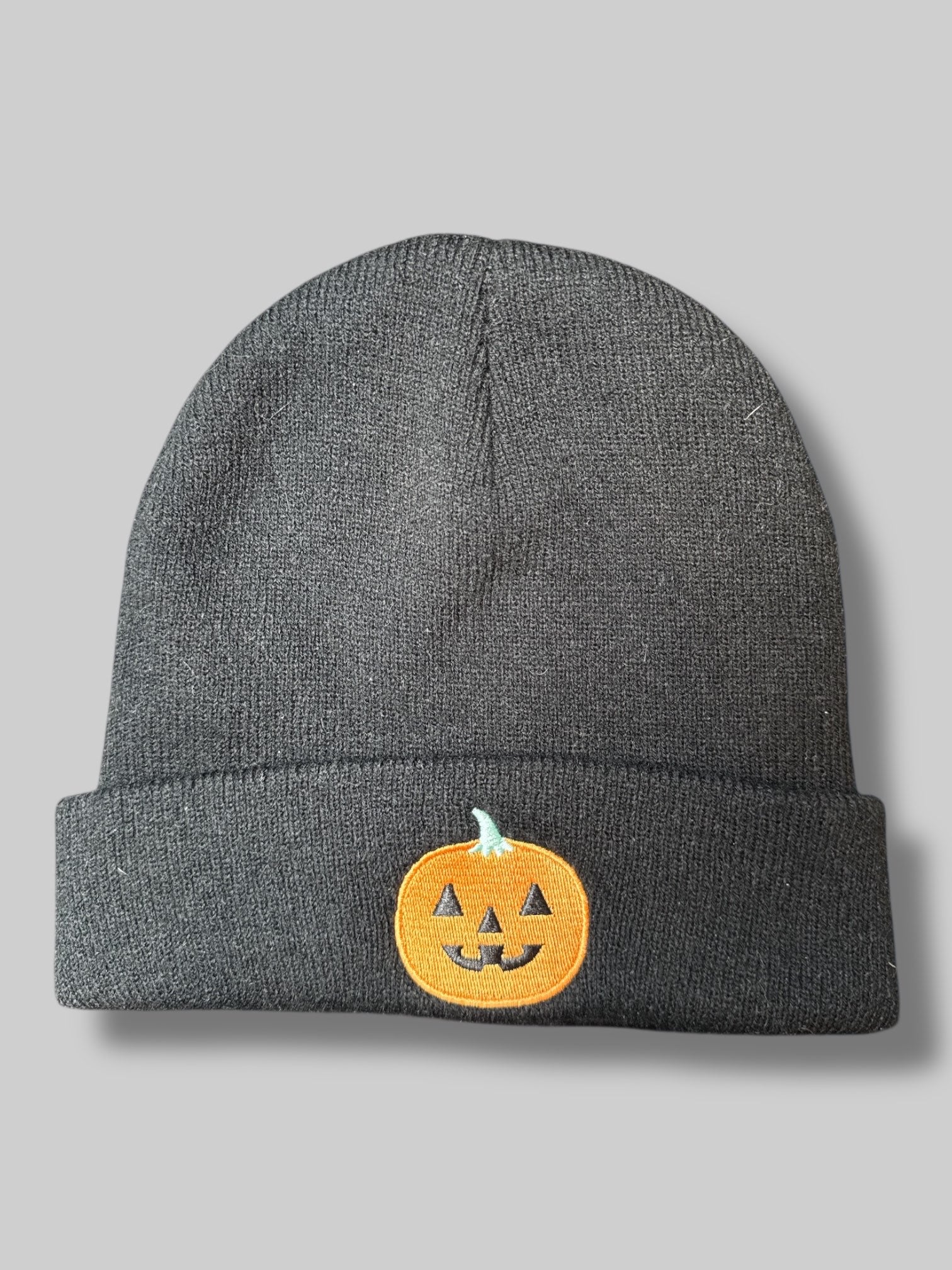 Black beanie with jack o lantern
