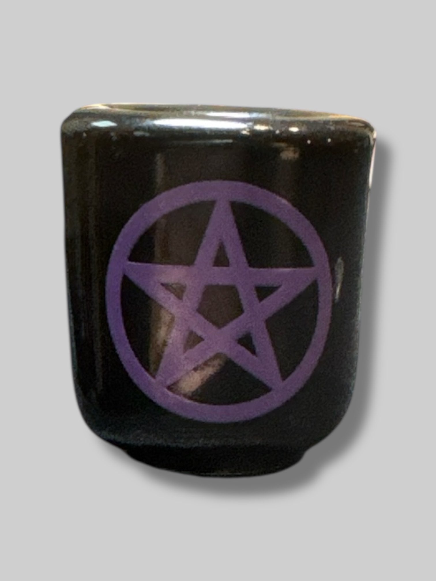 Black candle holder with purple pentagram