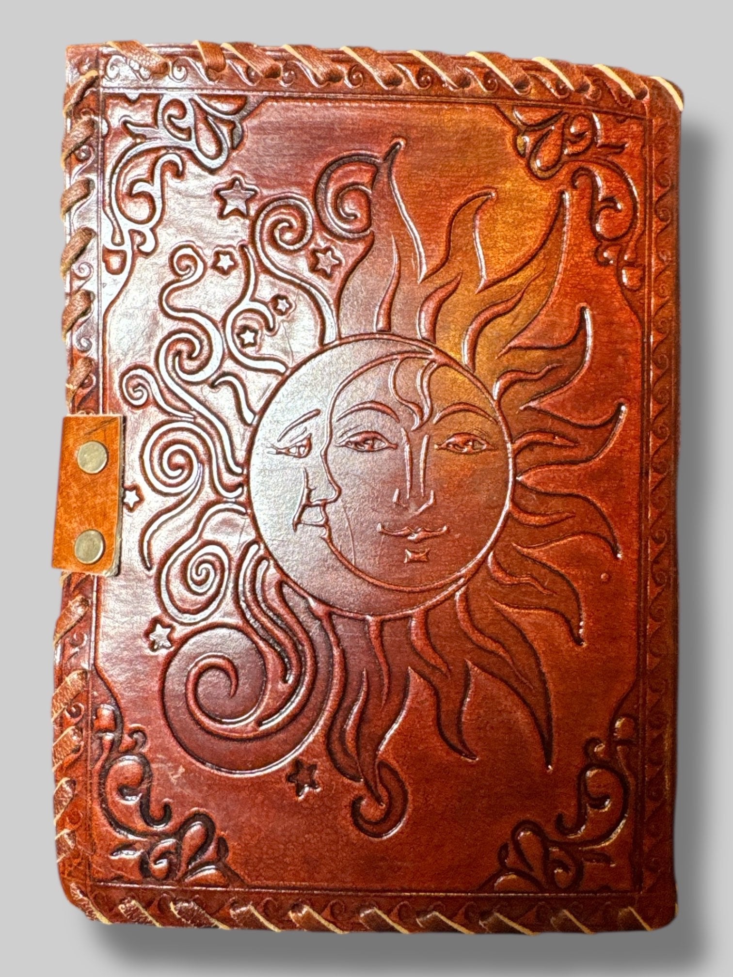 Leather journal with sun and moon design