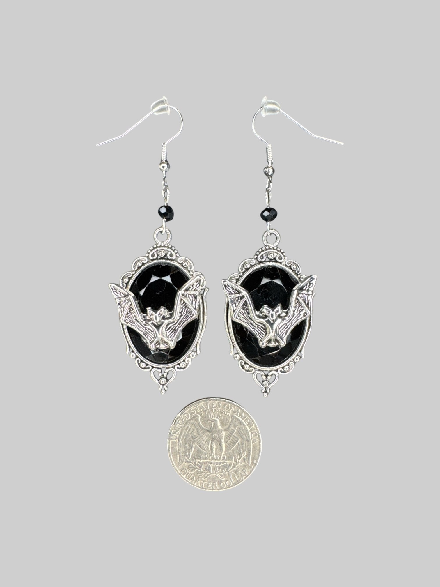 Dangly ornate gemstone earrings with metal bats