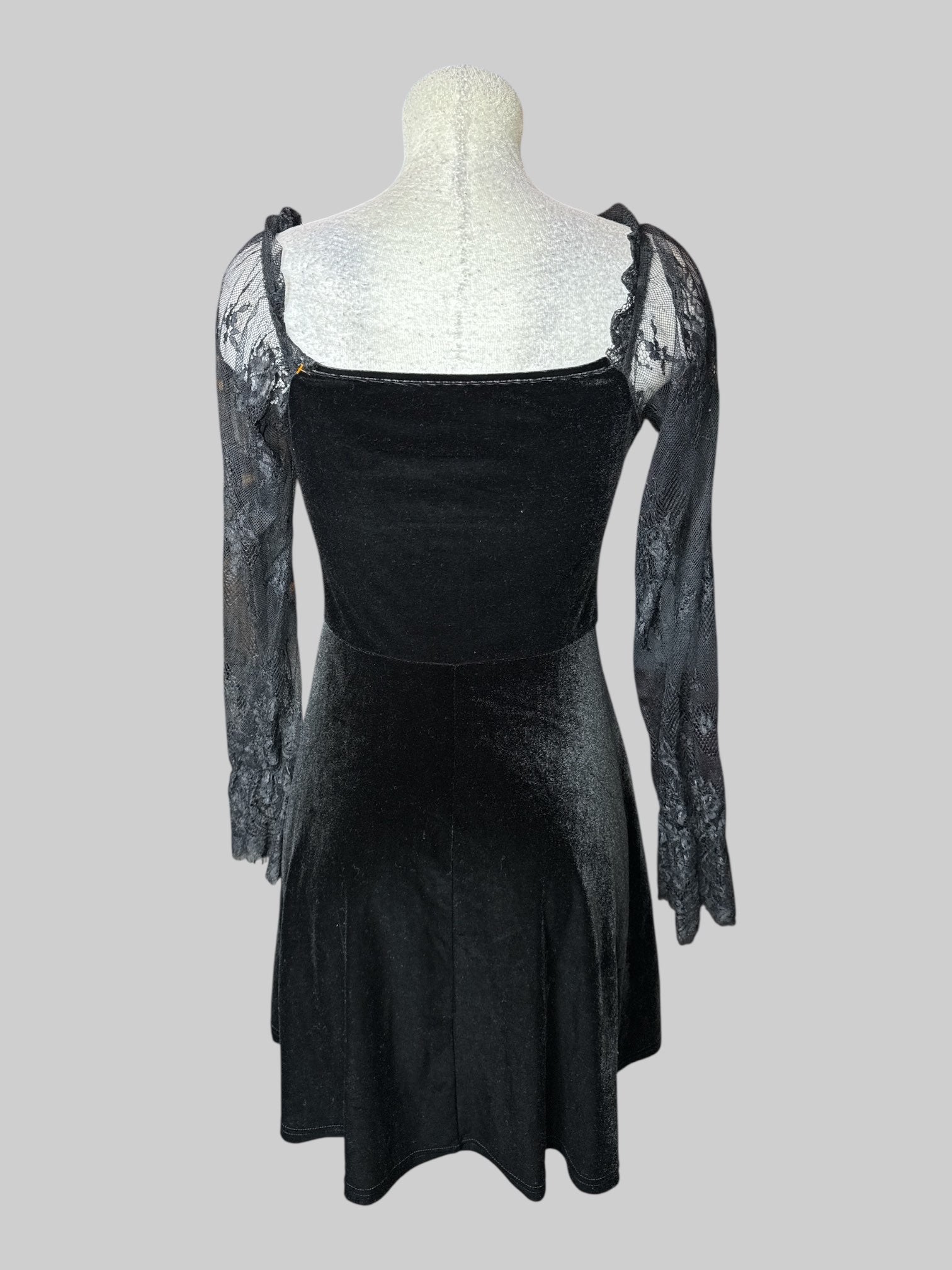 M black velvet long sleeve dress with lace off the shoulder sleeves, and two lacing sections on front