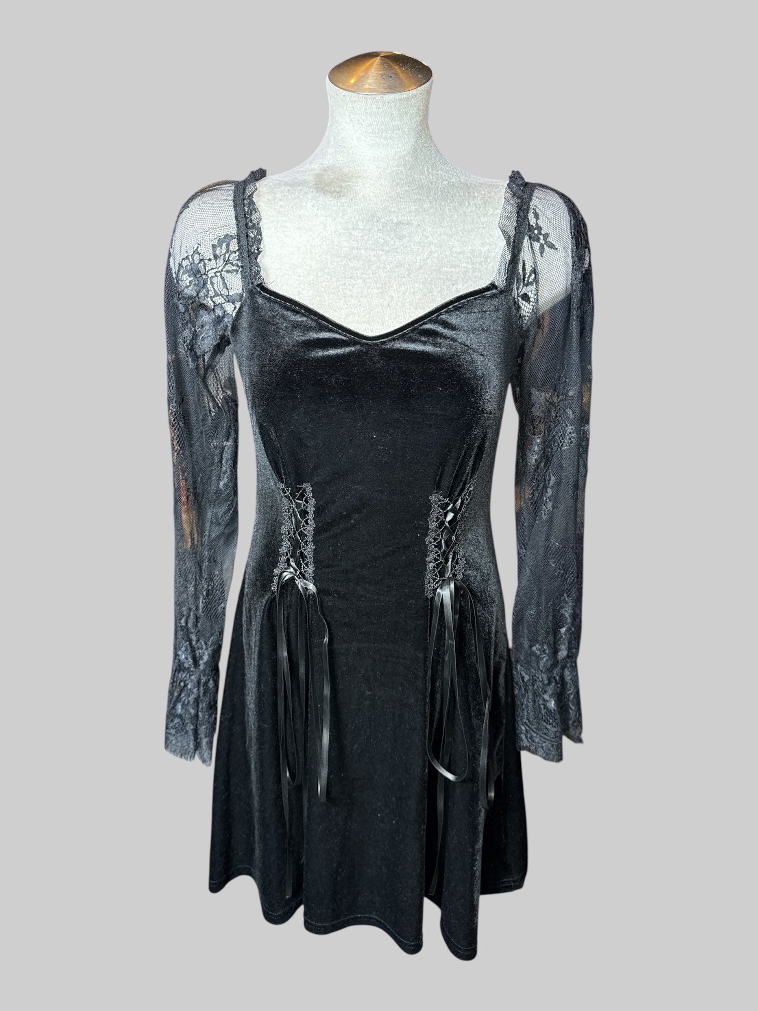 M black velvet long sleeve dress with lace off the shoulder sleeves, and two lacing sections on front