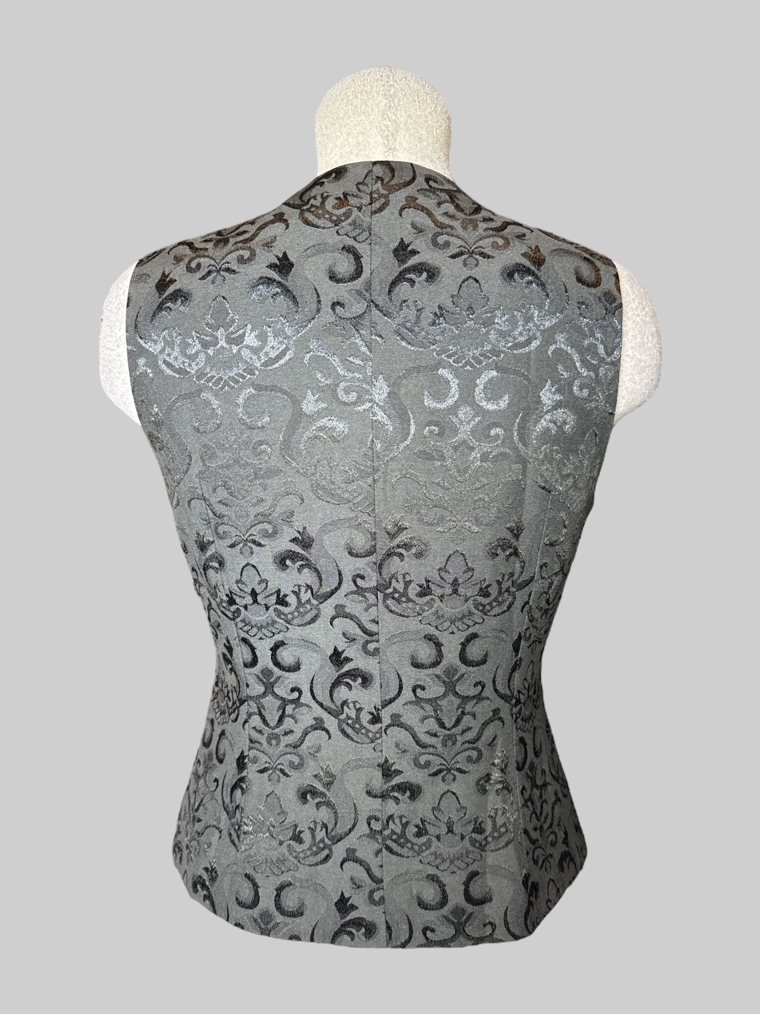 M black vest with ornate embroidered filigree