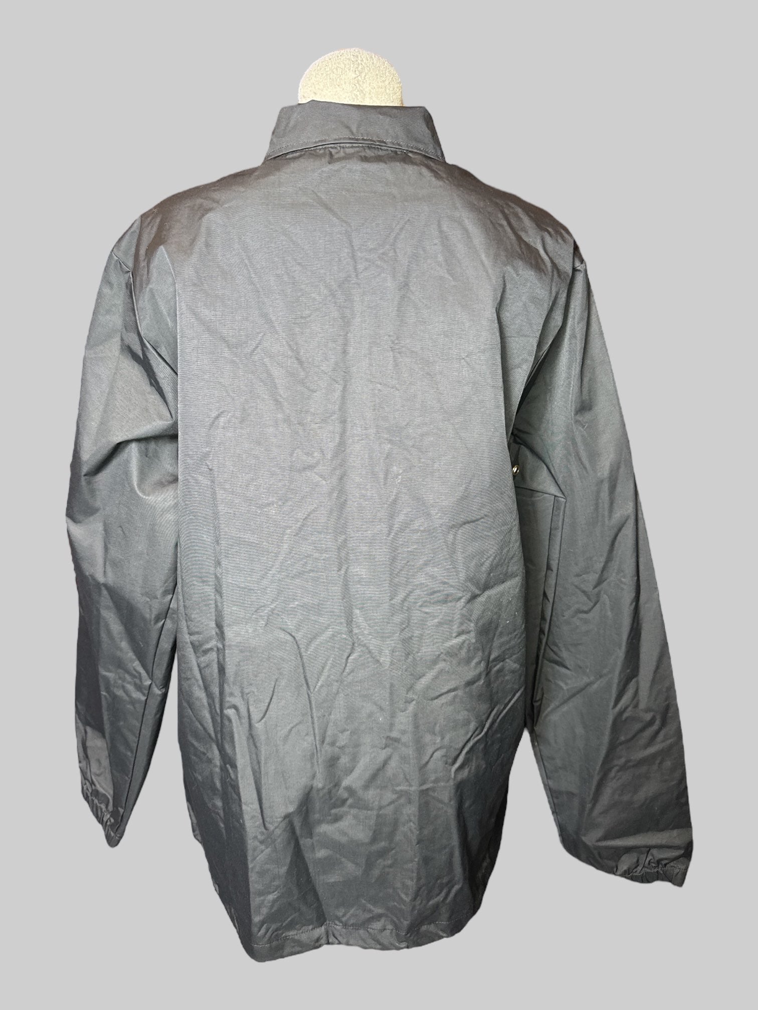 L long sleeve Skull Candy rain jacket with snap buttons pockets and elastic cuffs