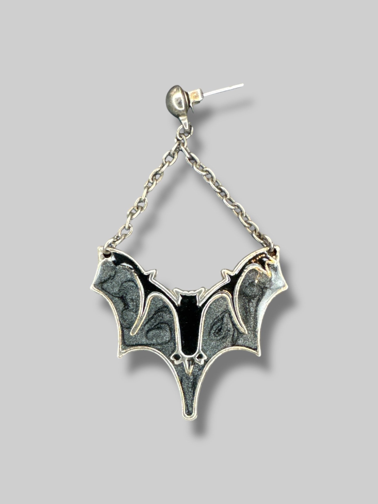 Metal dangle bat earrings with grey sparkly and black resin