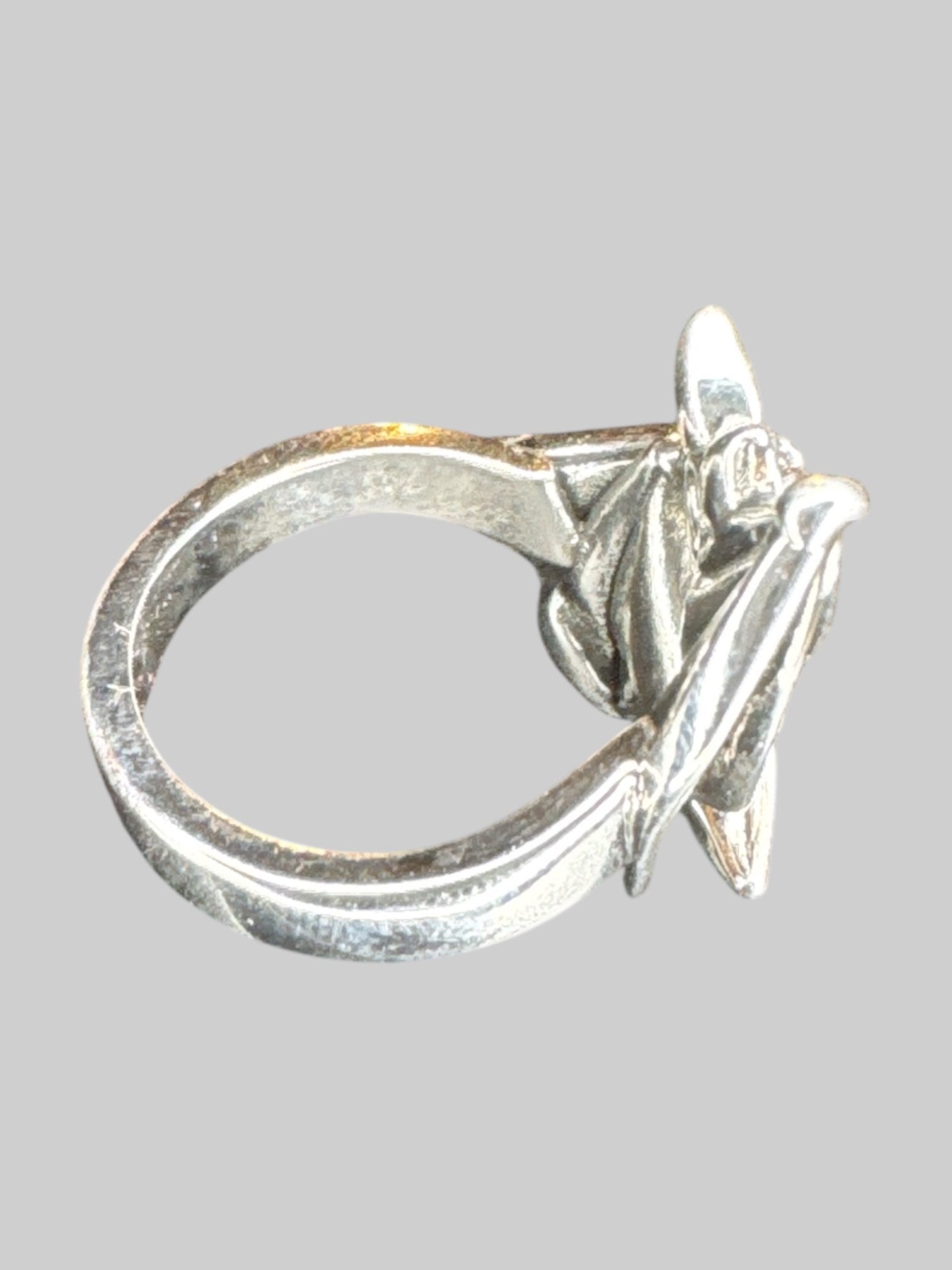 Adjustable silver tone wraparound bat ring