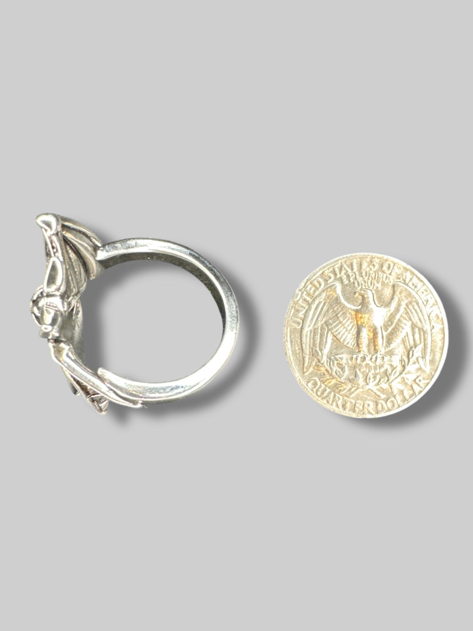 Adjustable silver tone wraparound bat ring