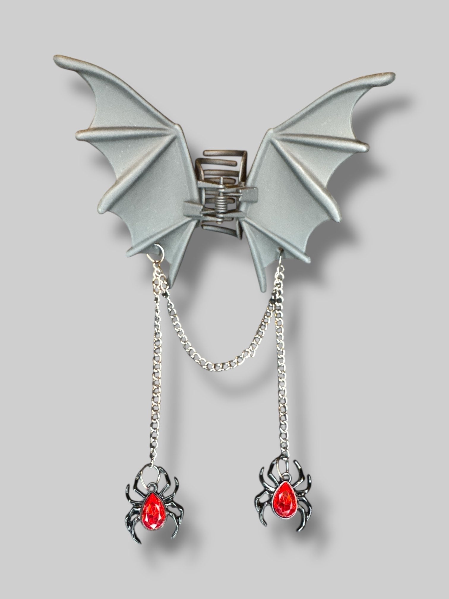 Bat wing hair clip with dangling spider chains