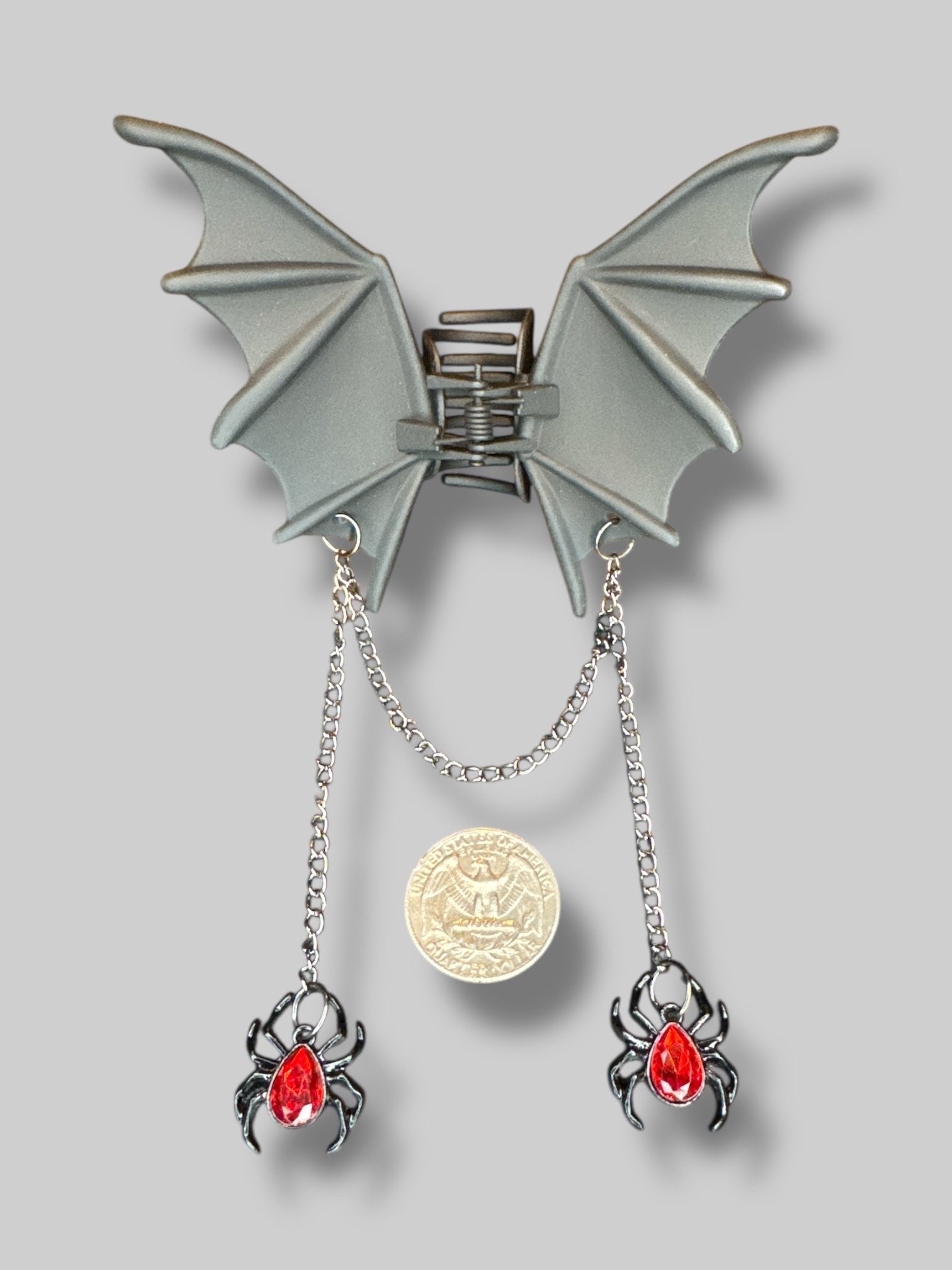 Bat wing hair clip with dangling spider chains