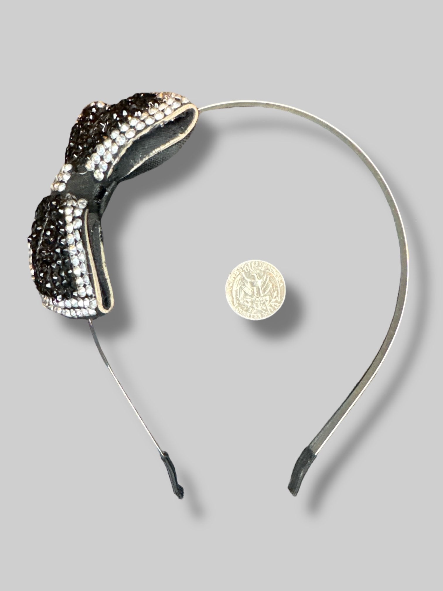 Black metal headband with black and silver bedazzled bow