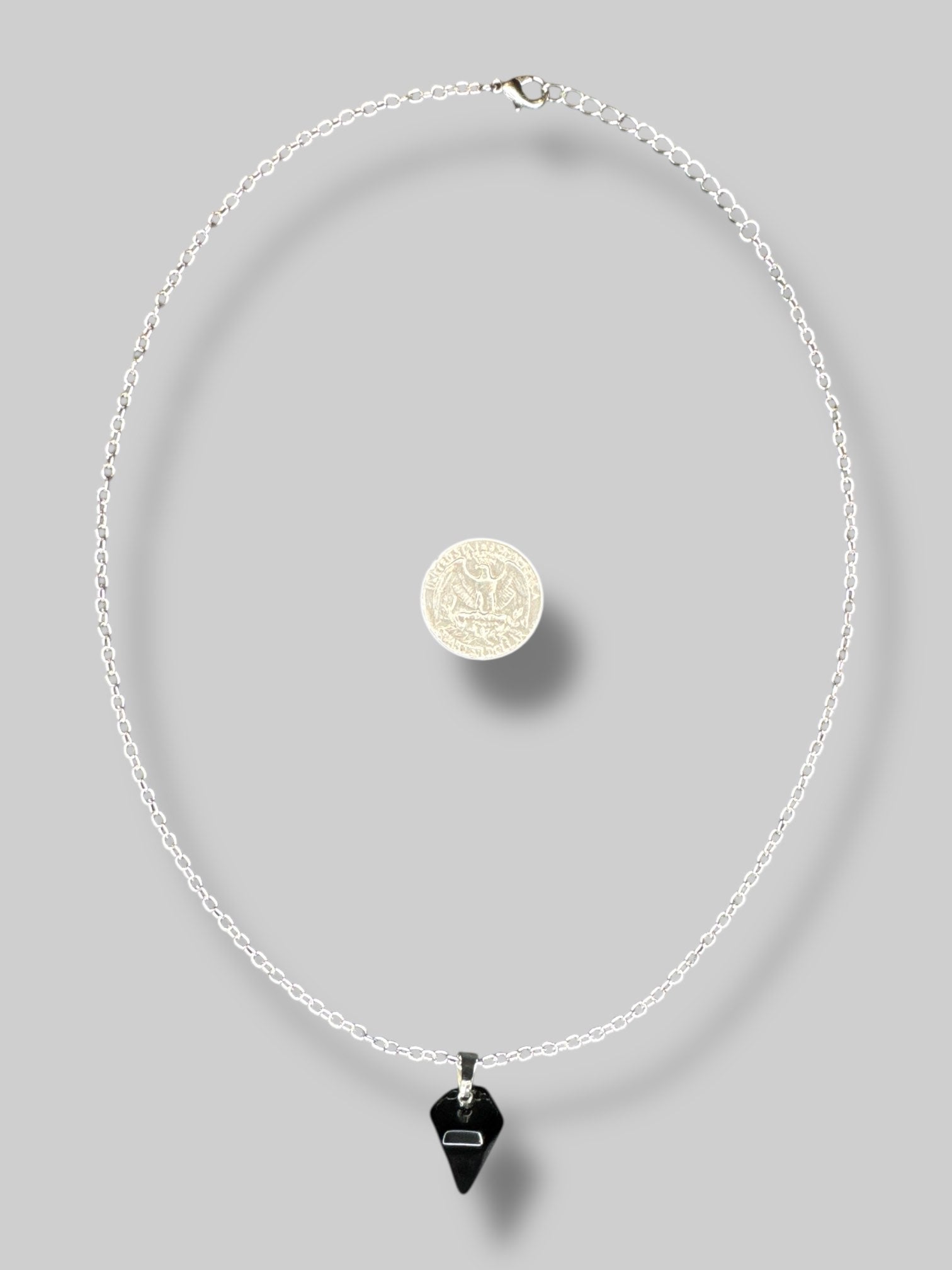 Black pendulum necklace with silver tone chain