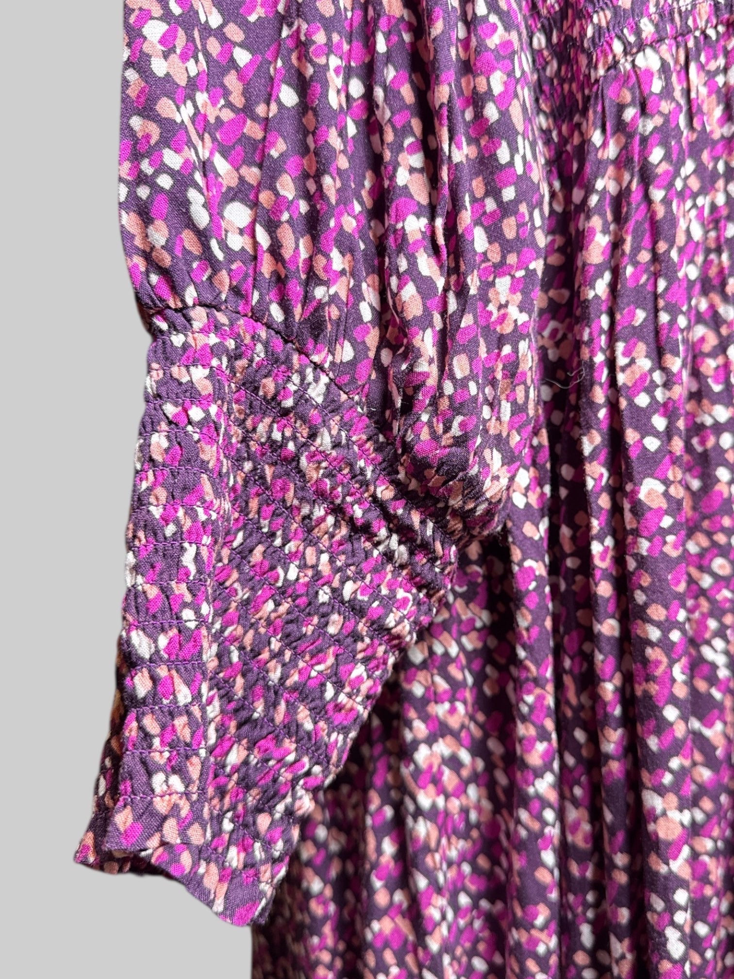3X purple dress with pink, orange, and white geometric pattern, shirred waist, and shirred cuffs