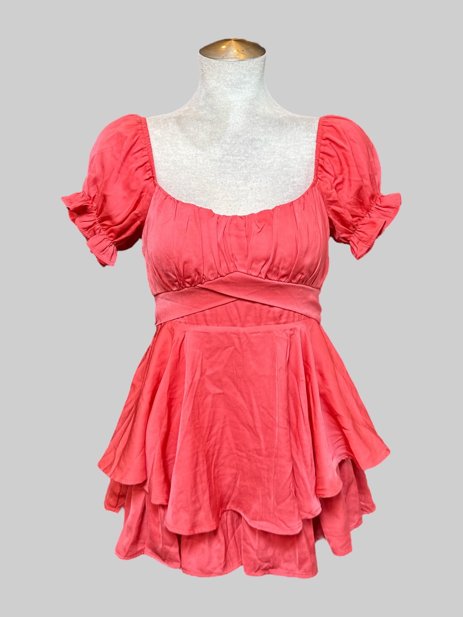 M coral, short sleeve romper with elastic, squared neckline, balloon sleeves, flowy layers, and tie on back