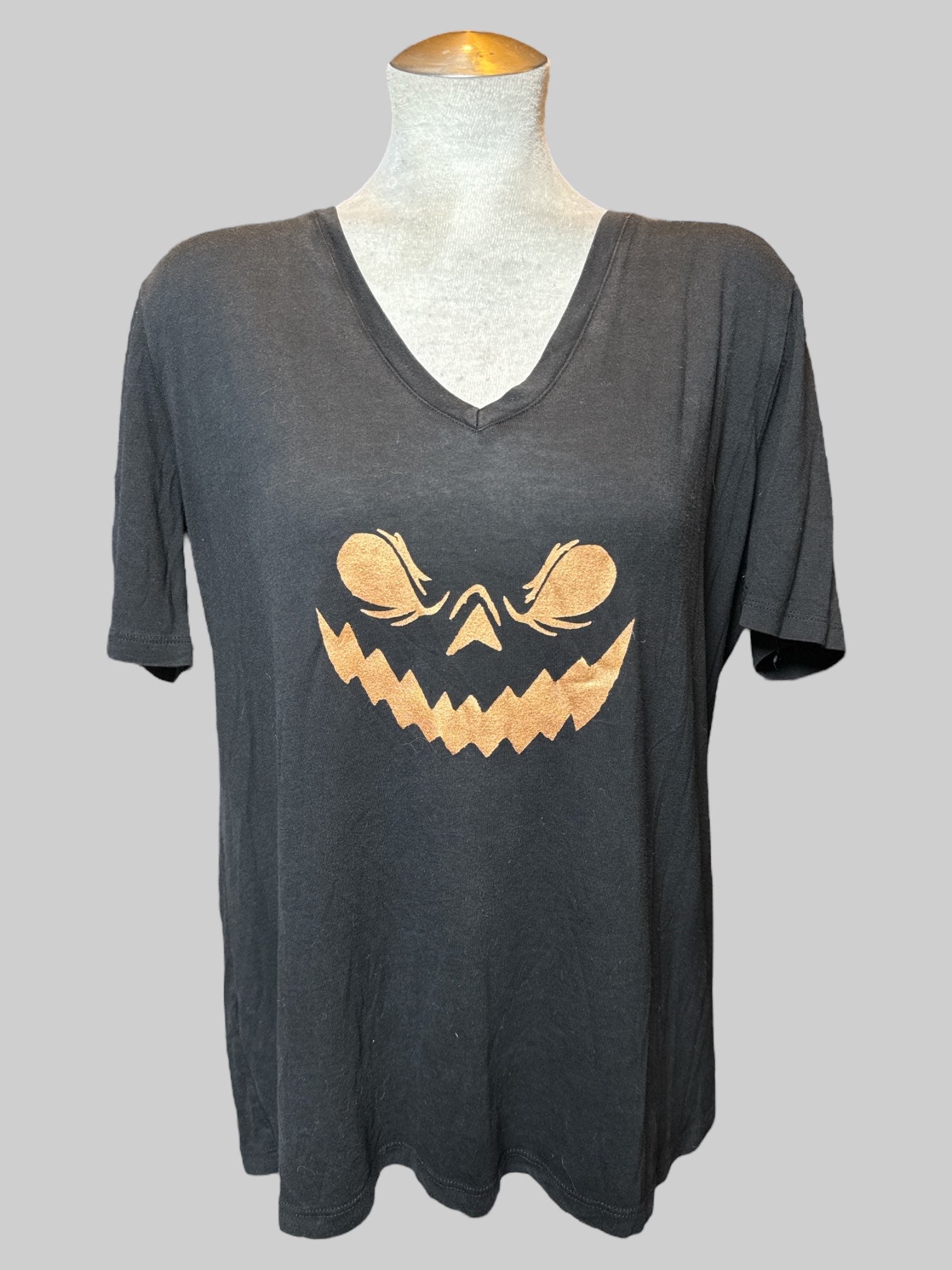 XL black tee with bronze jack-o’-lantern smile graphics on front and back