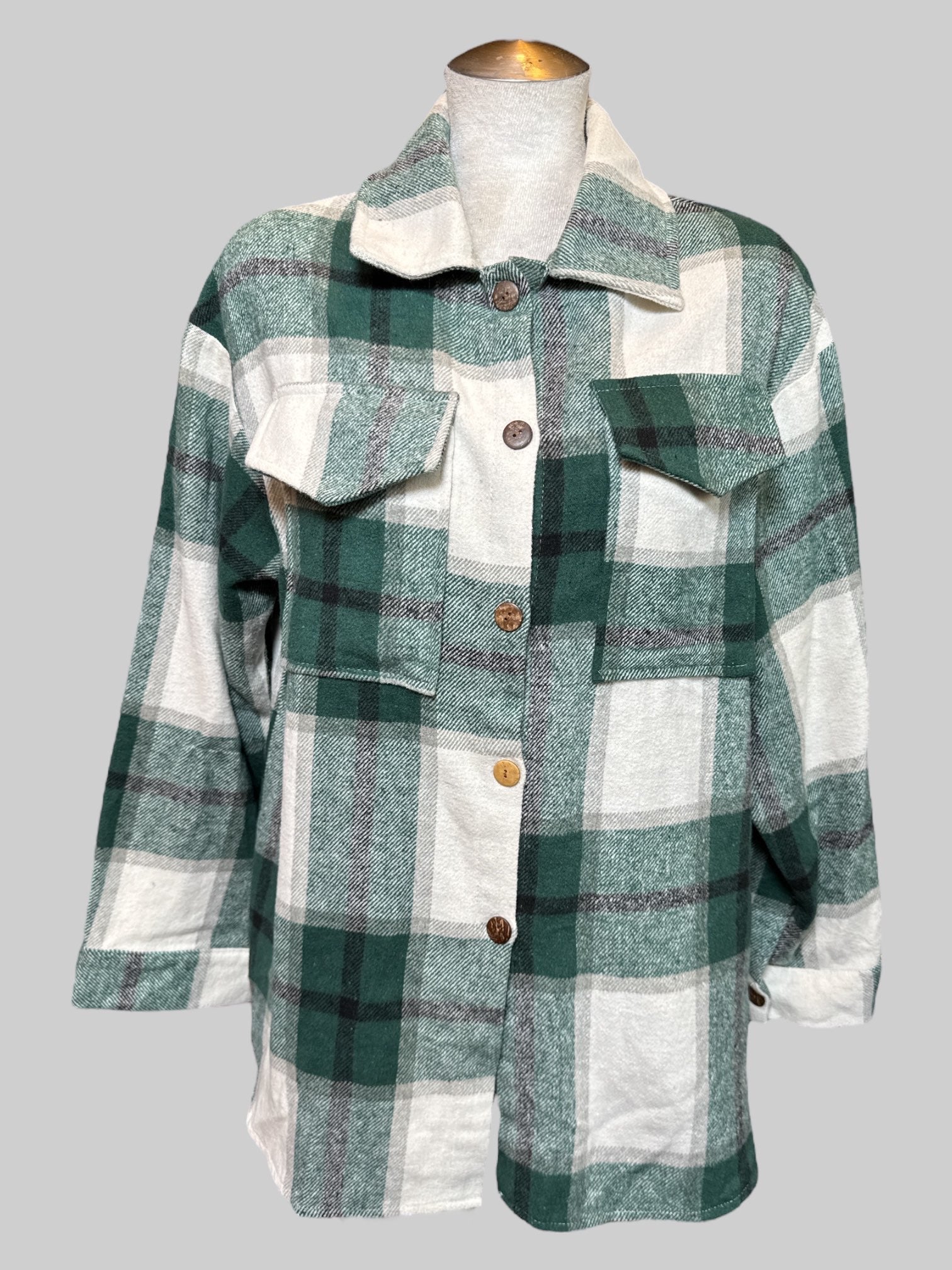 1X green, white and black plaid flannel with two front pockets and wooden buttons