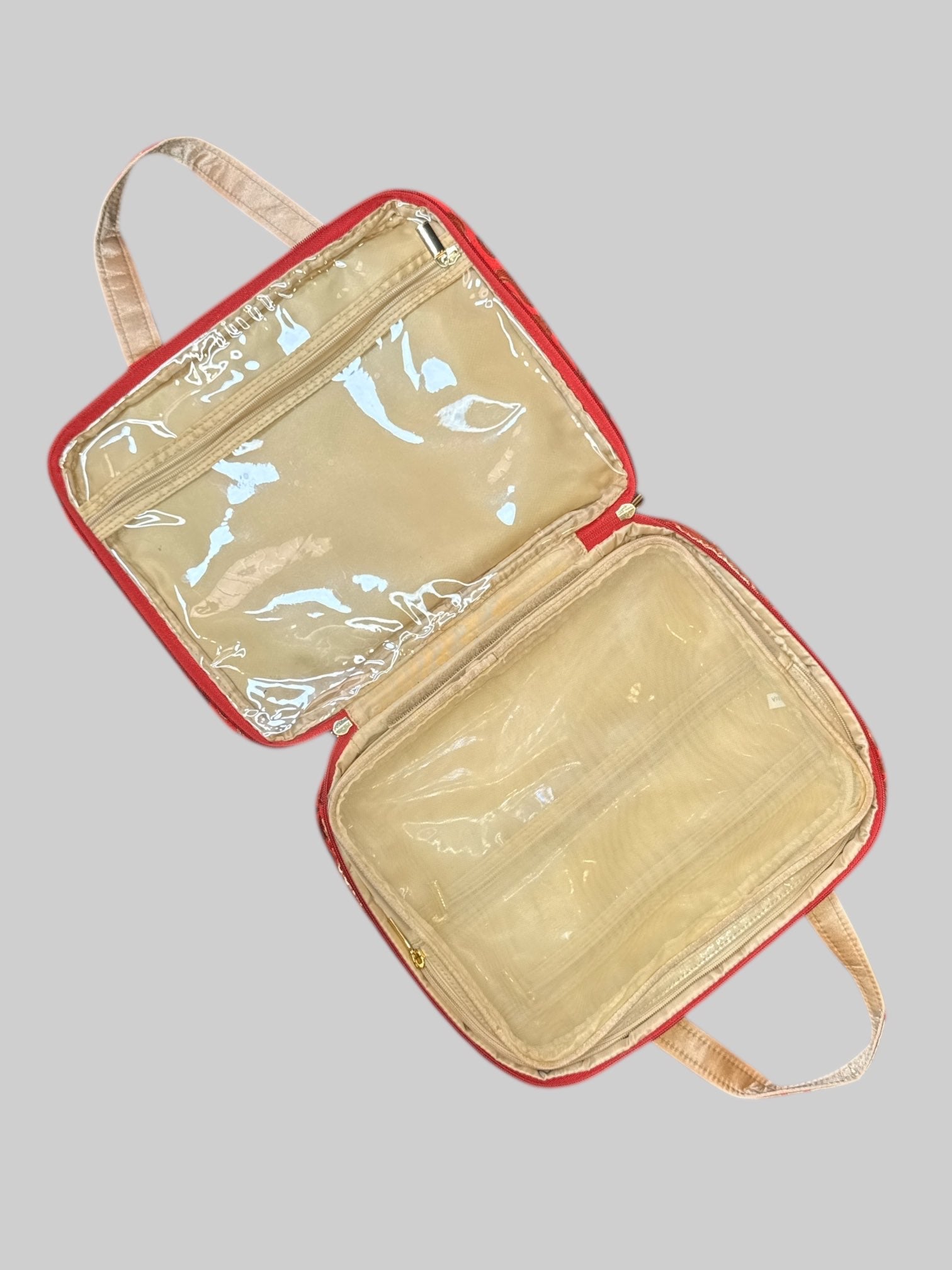Red and gold or Nately designed handbag with multiple zipper pockets inside, and Velcro removable inside mesh pocket