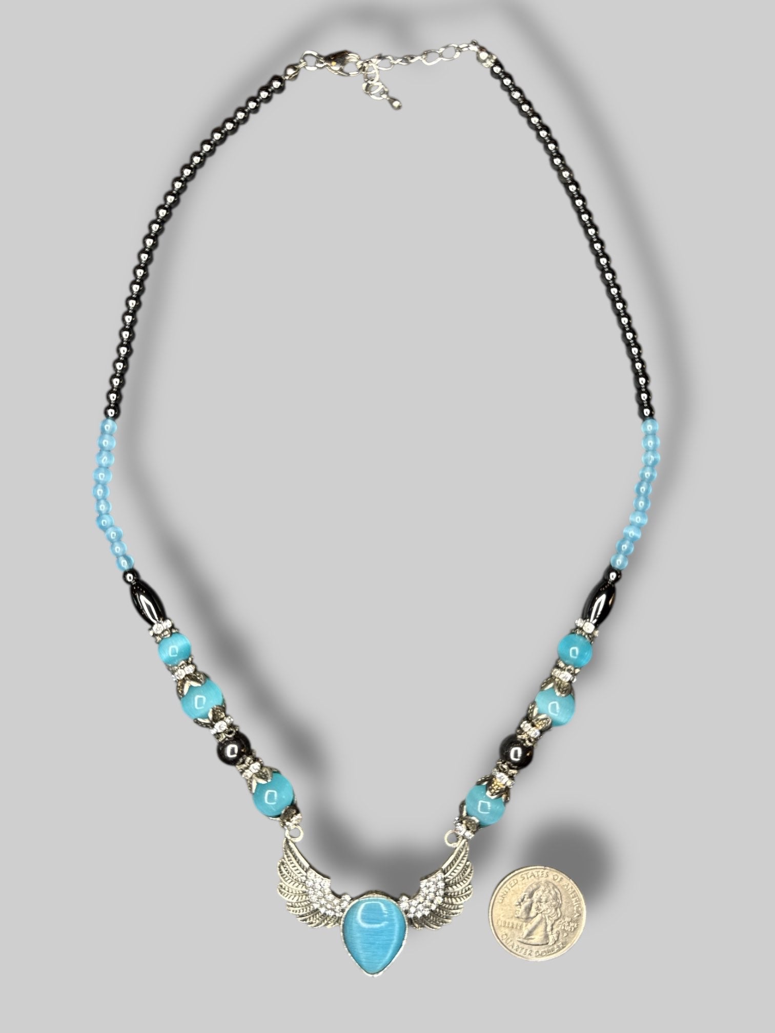 Multicolor beaded necklace with silver tone angel wings