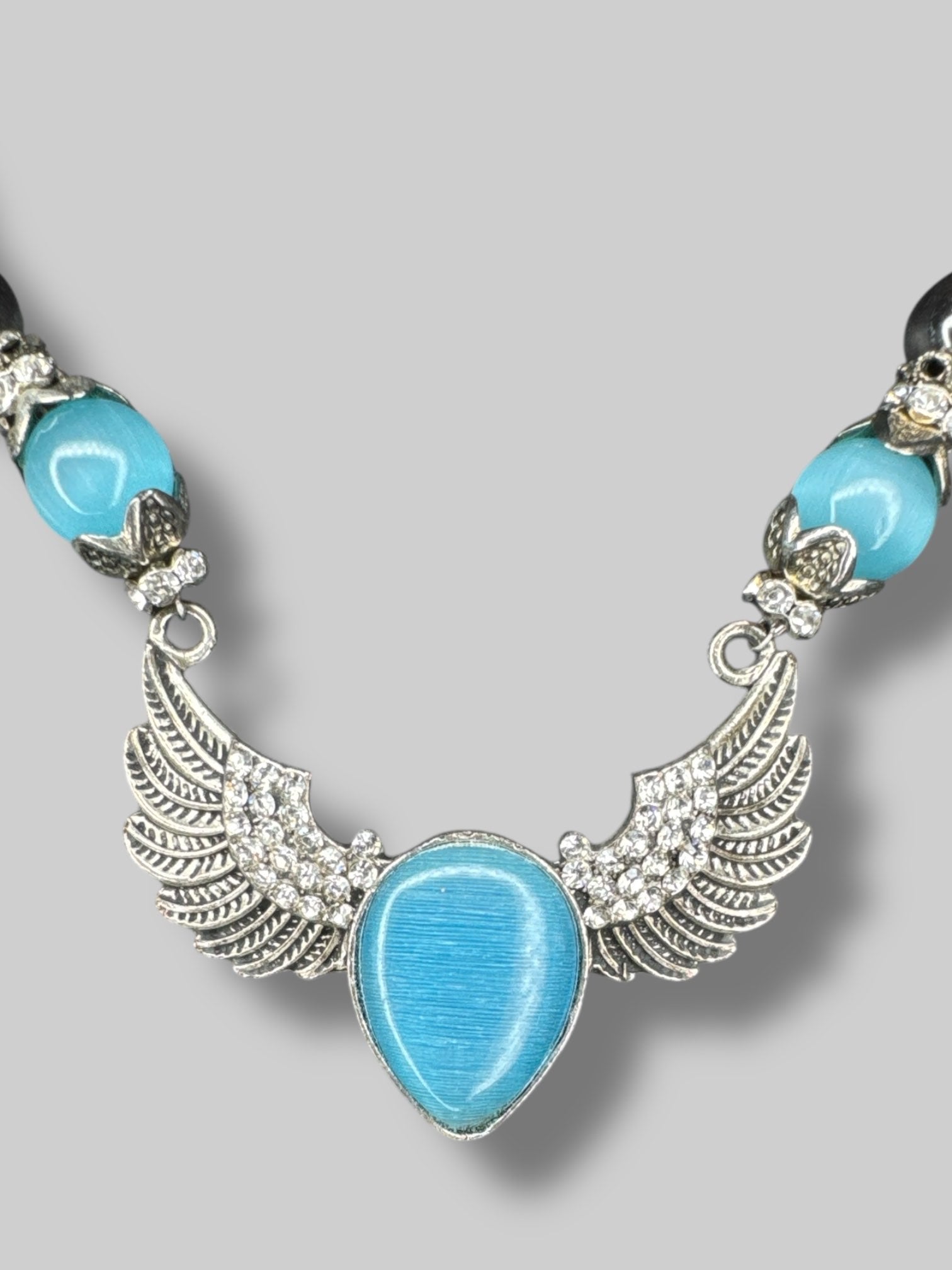 Multicolor beaded necklace with silver tone angel wings