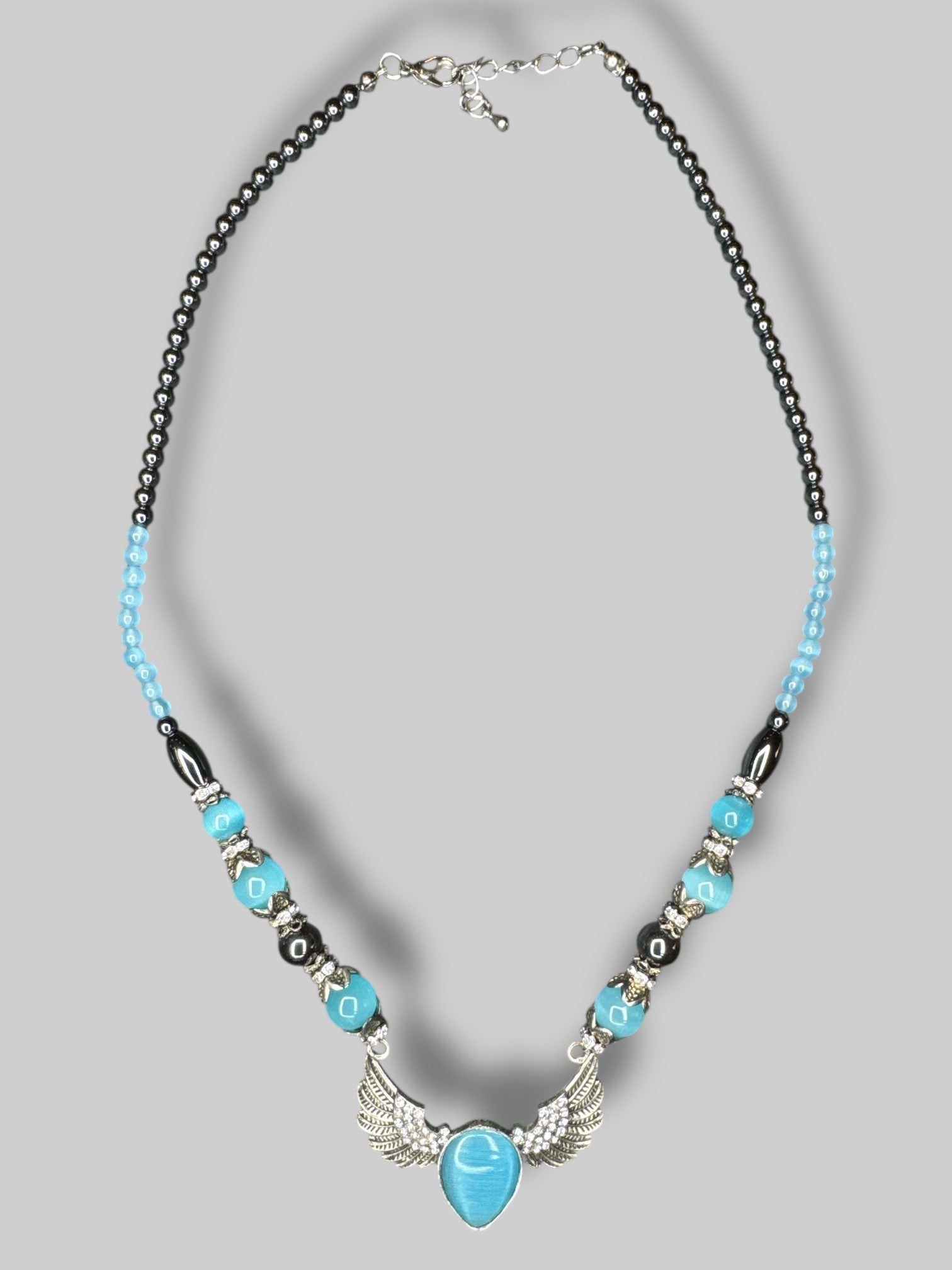 Multicolor beaded necklace with silver tone angel wings