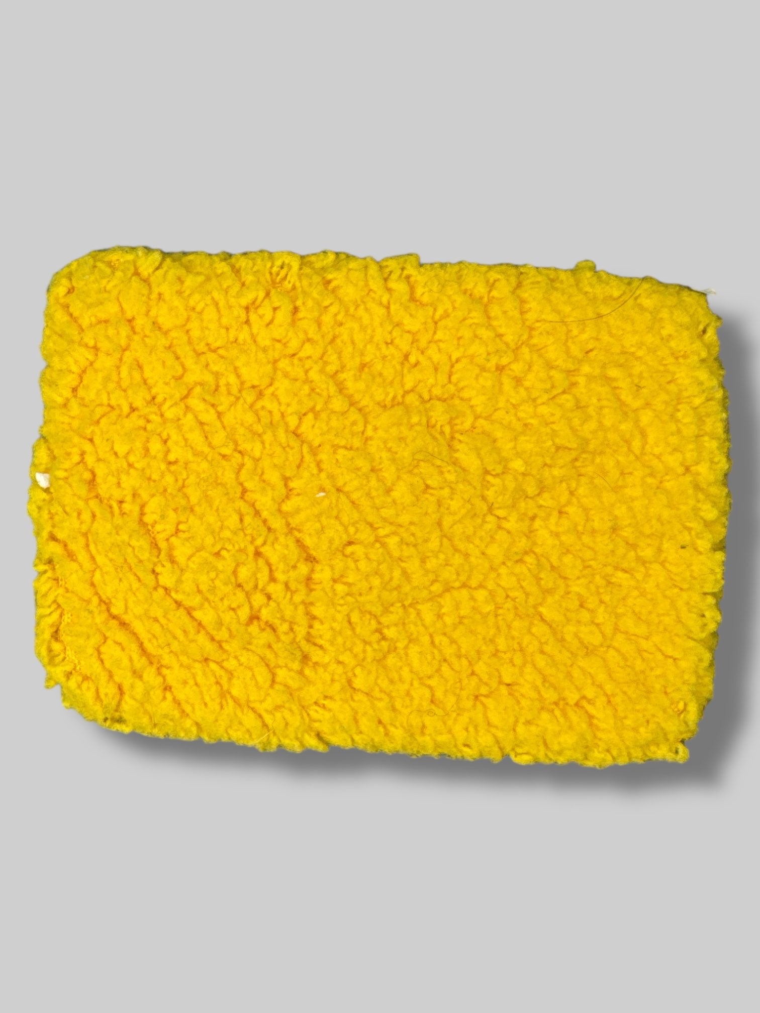 5” by 3” fuzzy yellow monster pouch